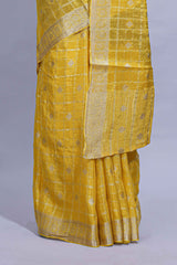 Yellow and violet double shaded zari checks georgette saree with small zari border and self pallu along with matching zari buttas blouse piece