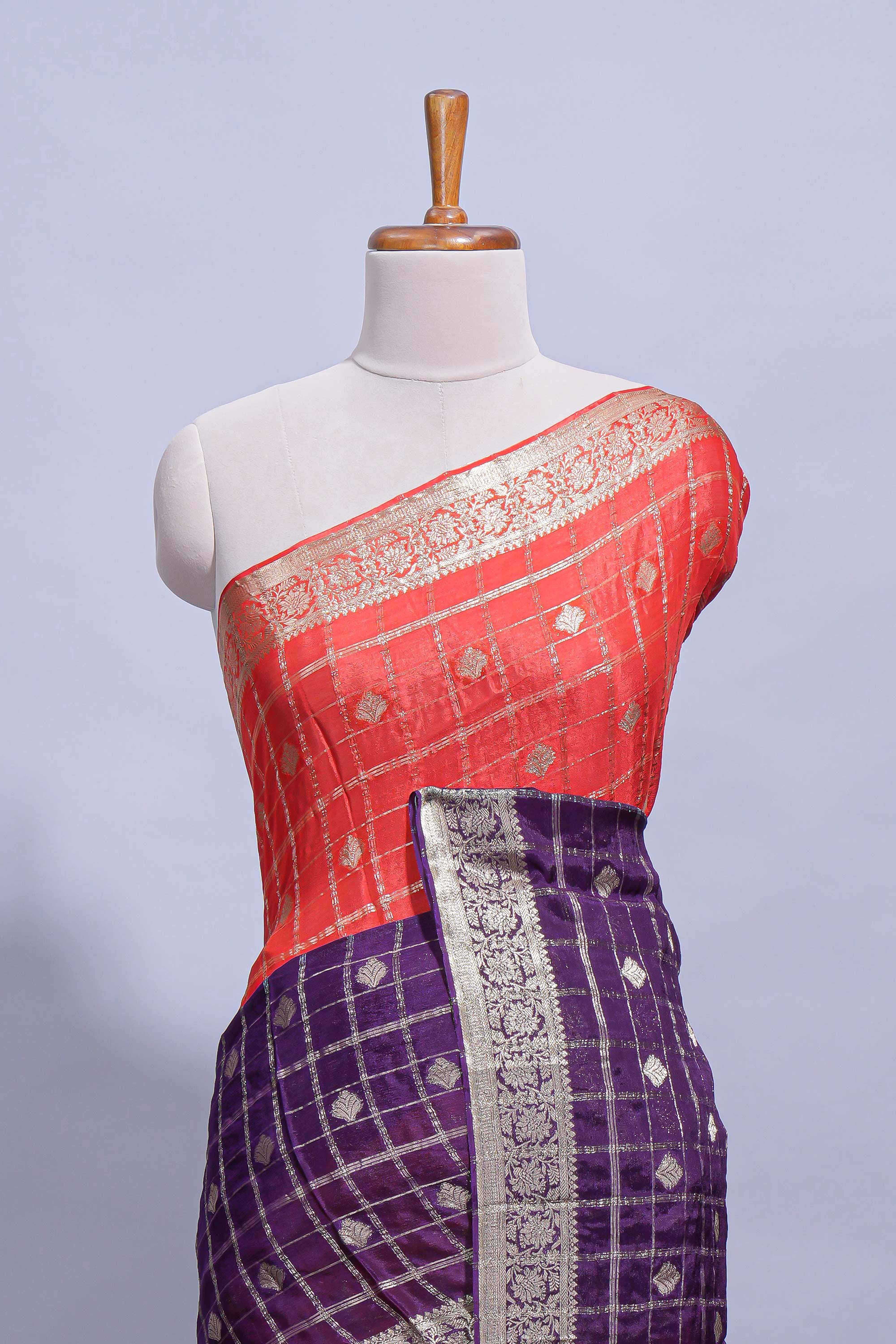 Red and violet double shaded zari checks georgette saree with small zari border and self pallu along with matching zari buttas blouse piece