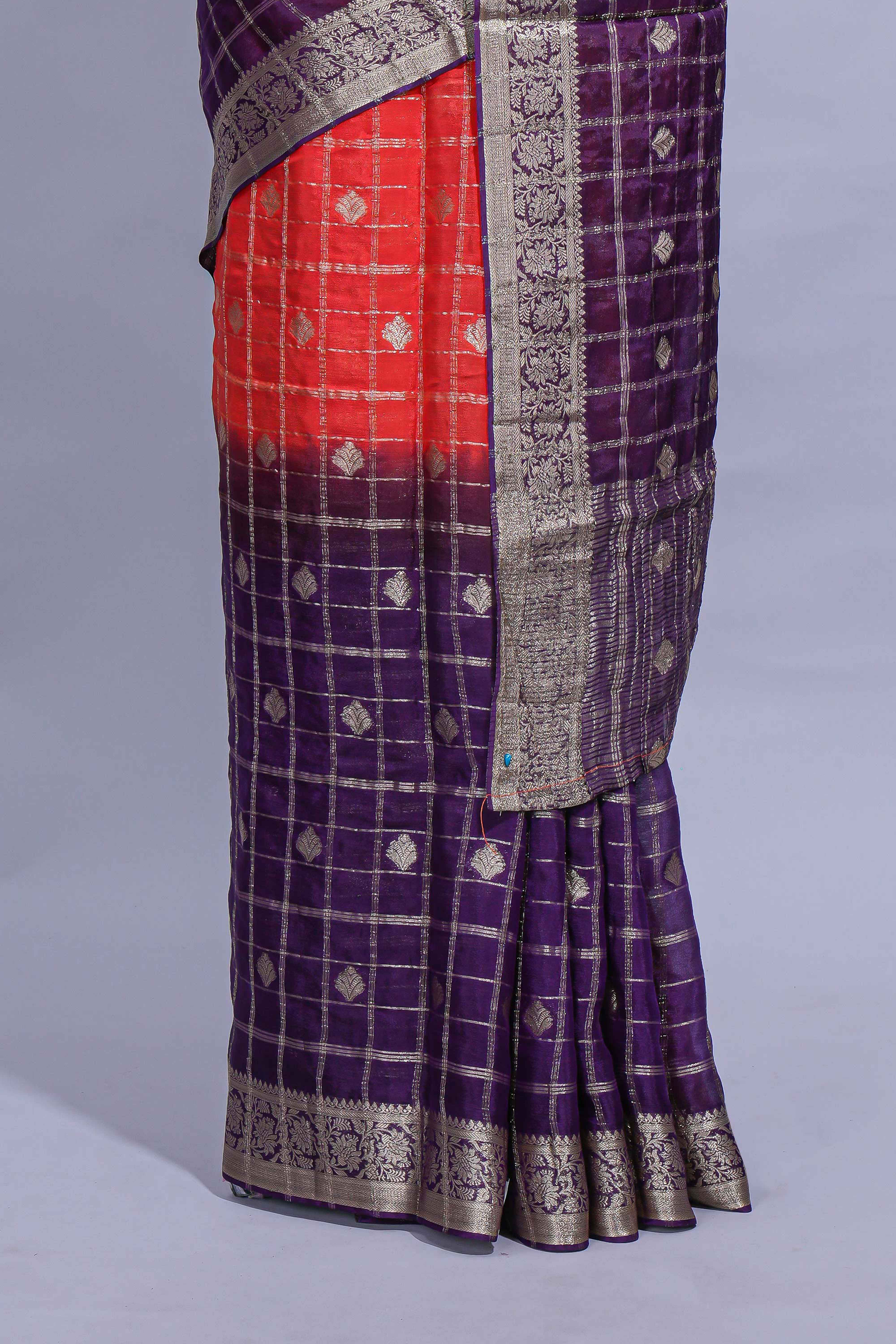 Red and violet double shaded zari checks georgette saree with small zari border and self pallu along with matching zari buttas blouse piece