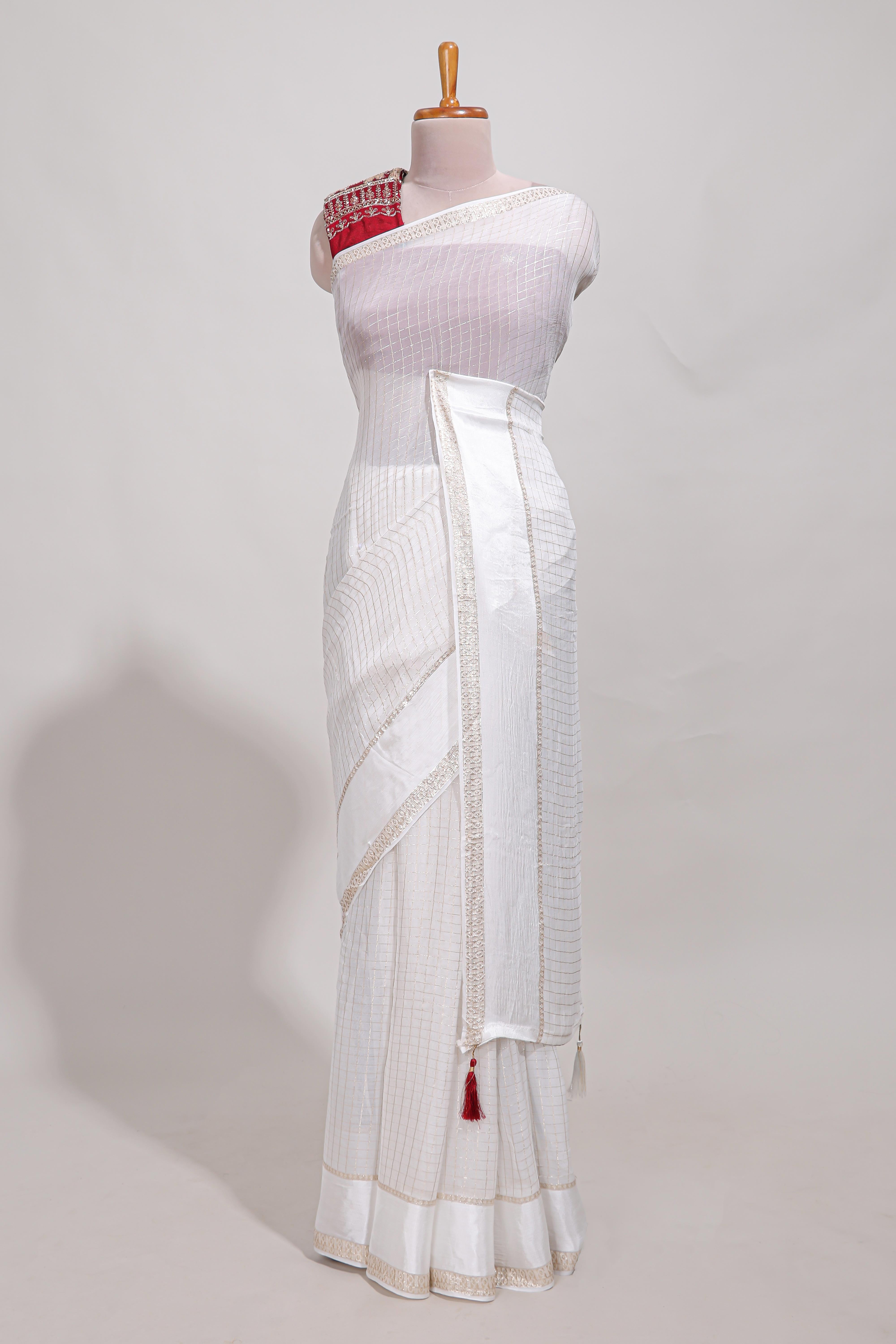 White zari checks georgette saree with small zari border and contrast aari work blouse