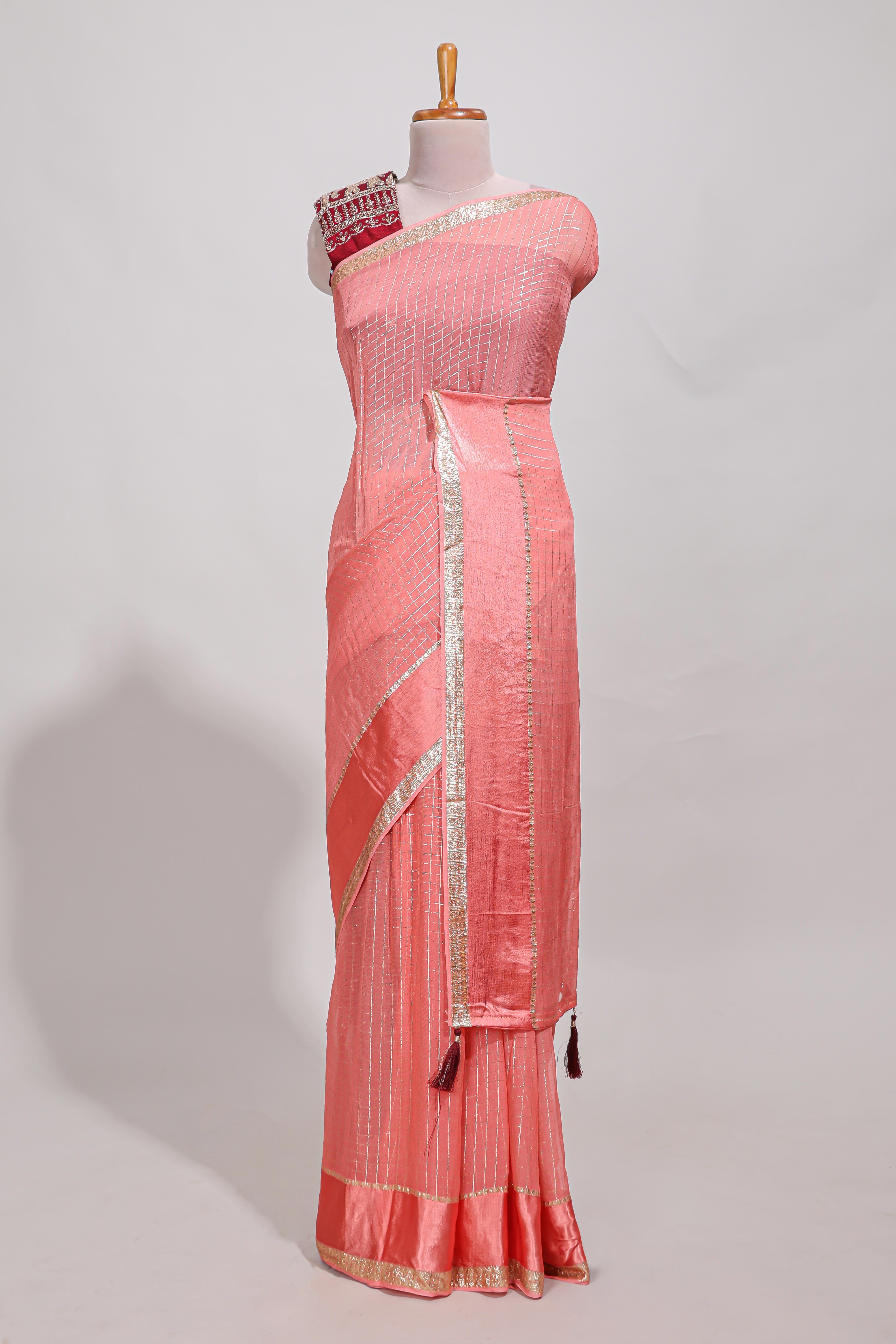 Peach zari checks georgette saree with small zari border and contrast aari work blouse