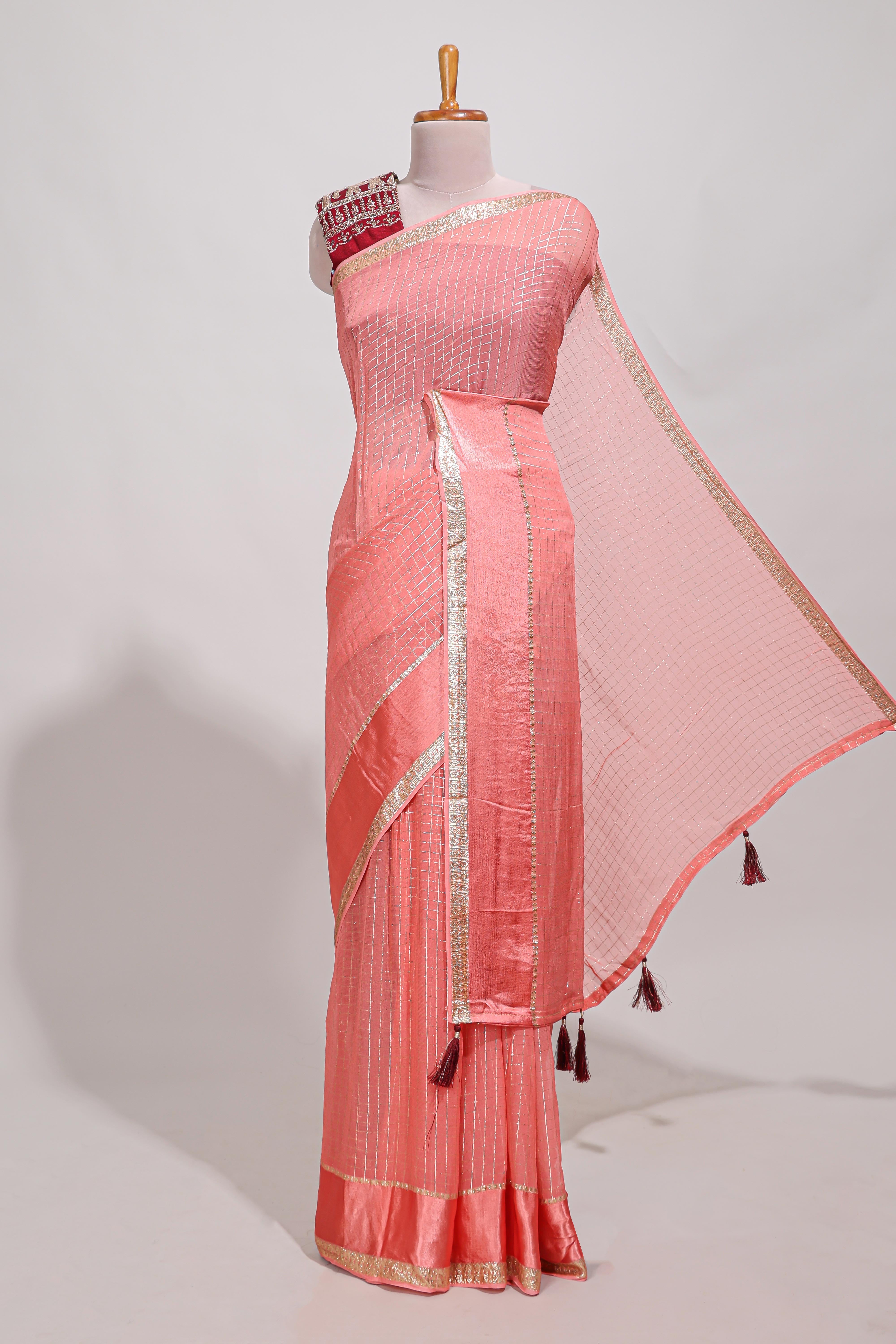 Peach zari checks georgette saree with small zari border and contrast aari work blouse