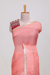 Peach zari checks georgette saree with small zari border and contrast aari work blouse