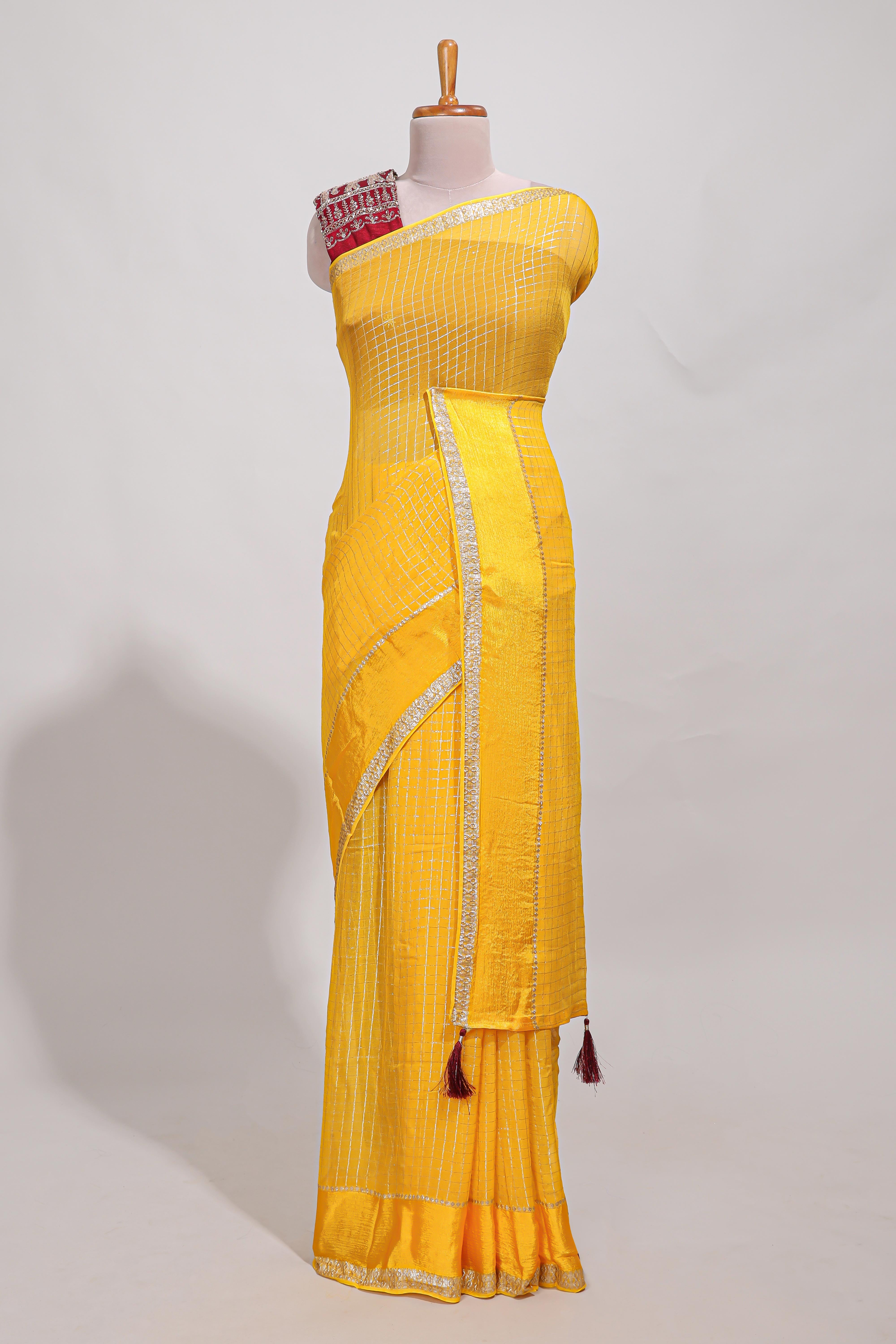 Peach zari checks georgette saree with small zari border and contrast aari work blouse