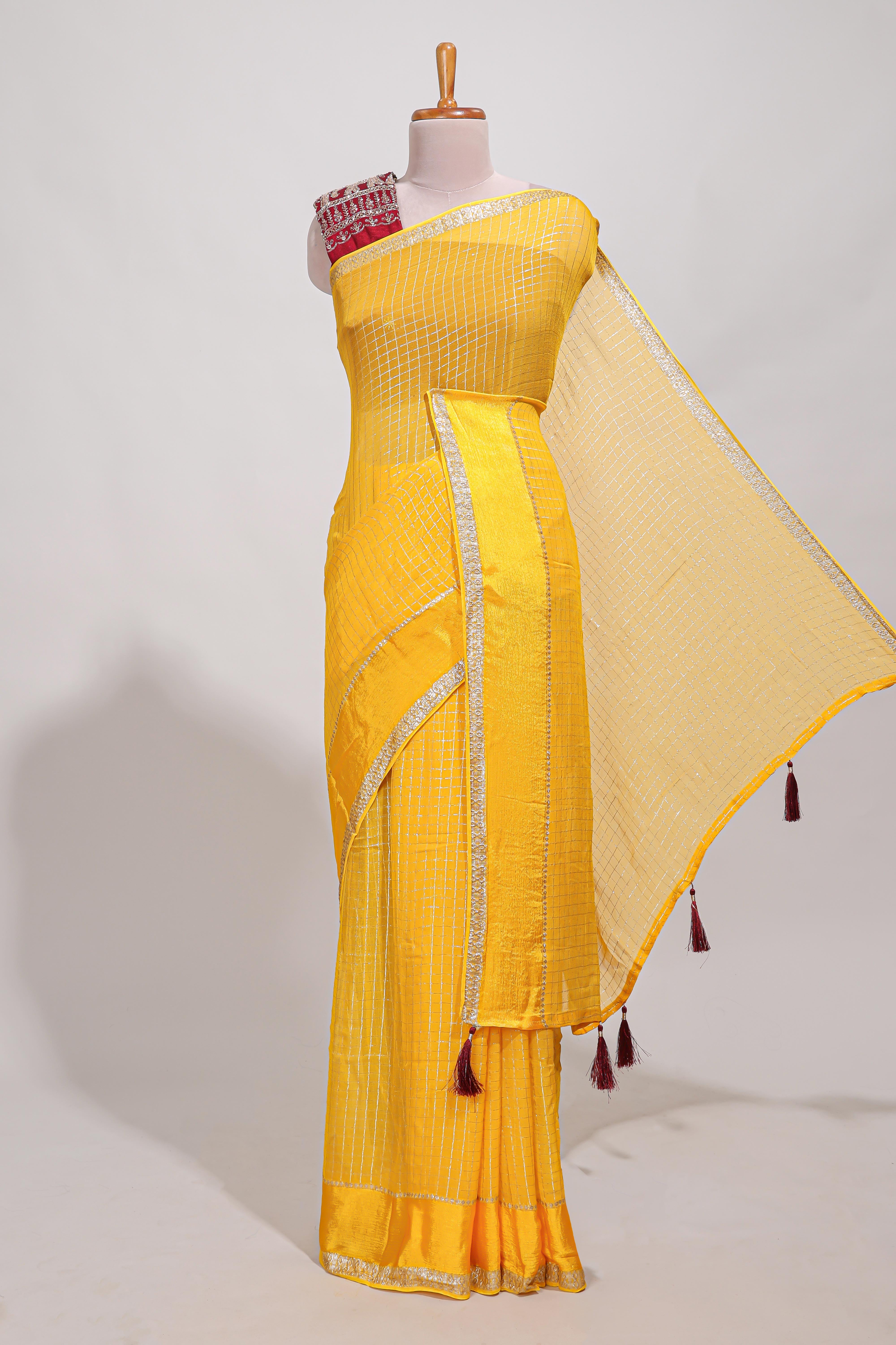 Peach zari checks georgette saree with small zari border and contrast aari work blouse
