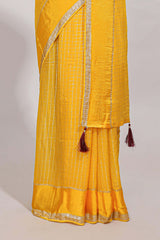 Peach zari checks georgette saree with small zari border and contrast aari work blouse