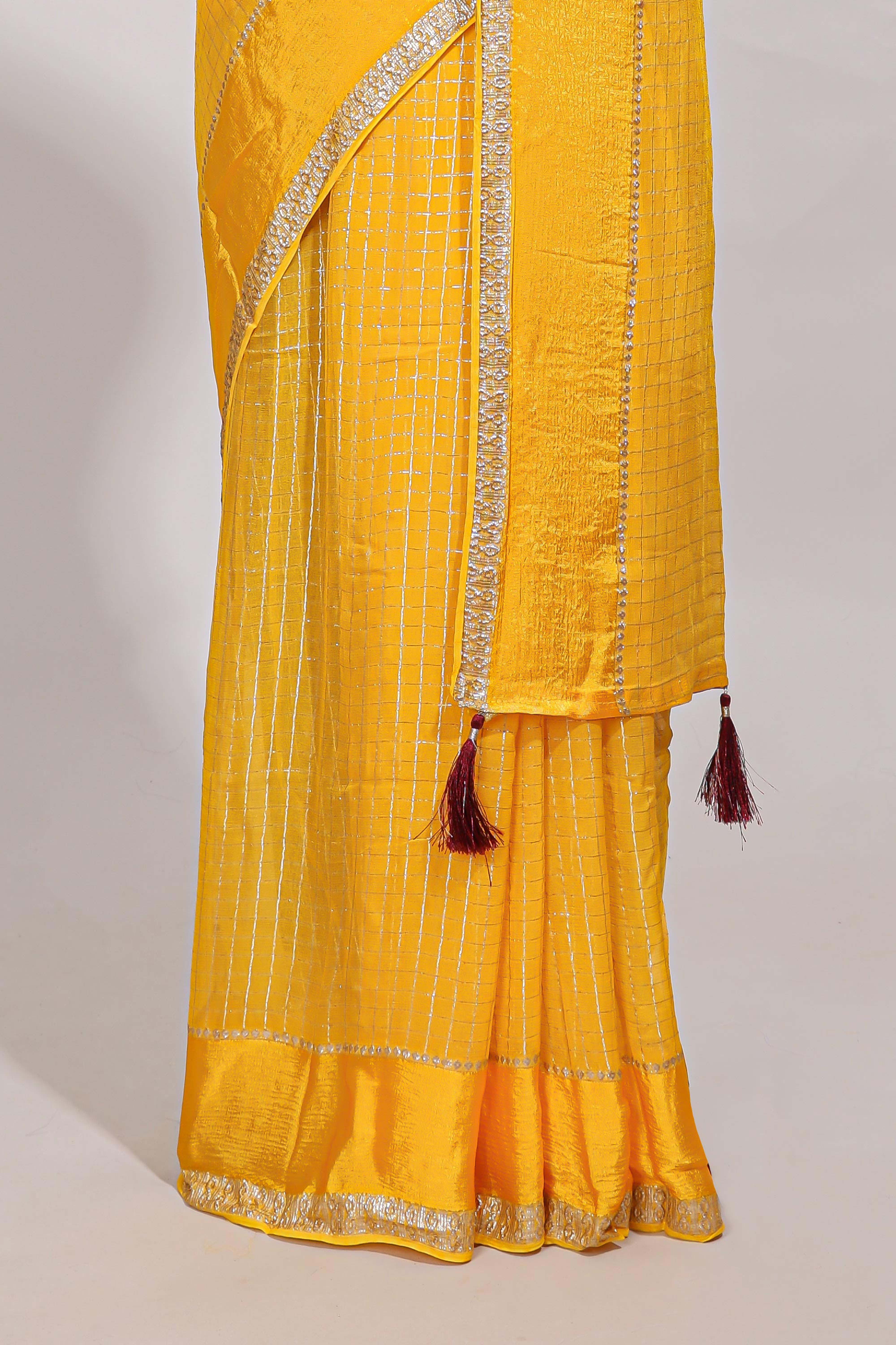 Peach zari checks georgette saree with small zari border and contrast aari work blouse