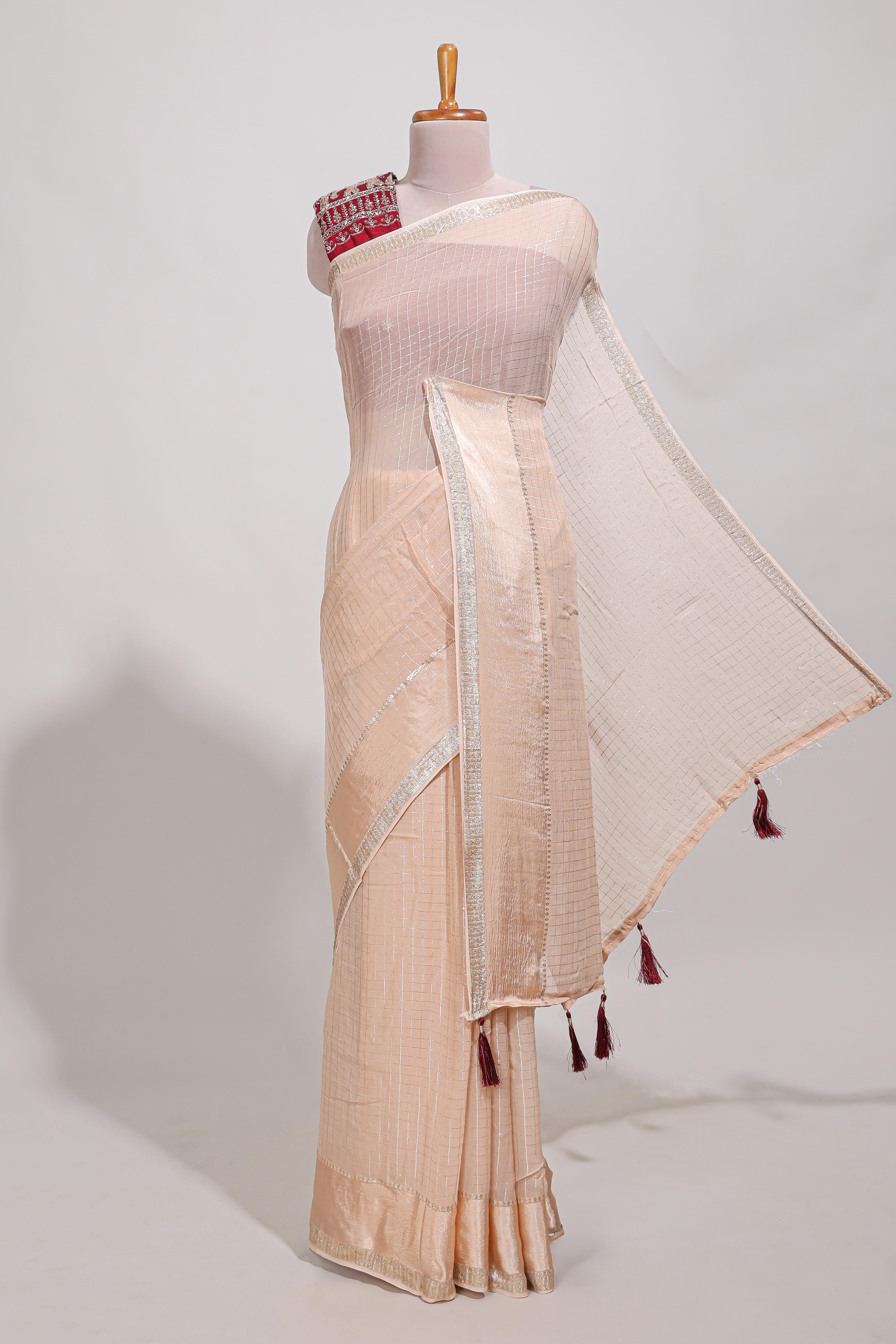 Cream zari checks georgette saree with small zari border and contrast aari work blouse