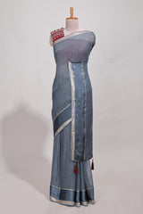 Gray zari checks georgette saree with small zari border and contrast aari work blouse