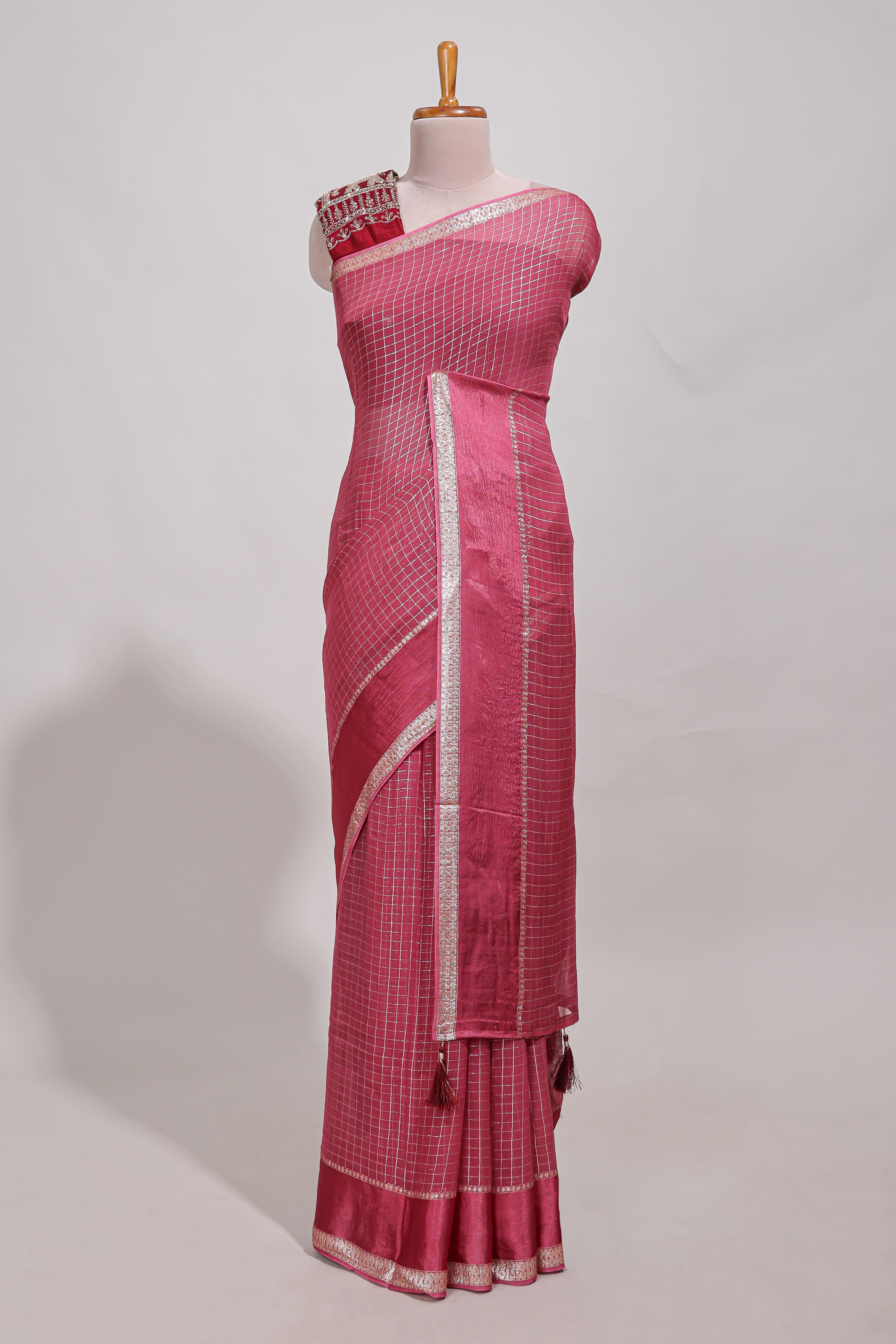 Magenta zari checks georgette saree with small zari border and contrast aari work blouse