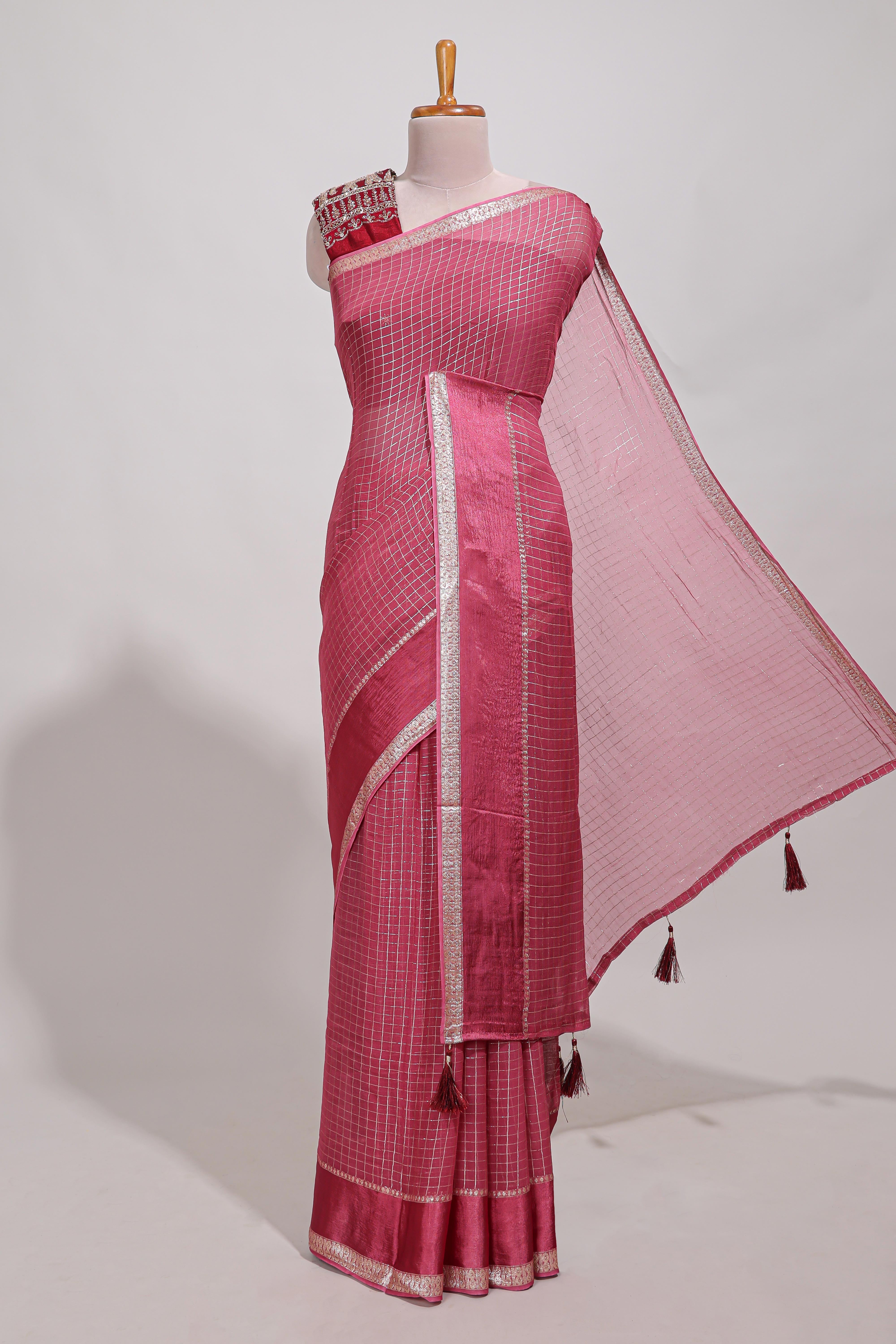 Magenta zari checks georgette saree with small zari border and contrast aari work blouse