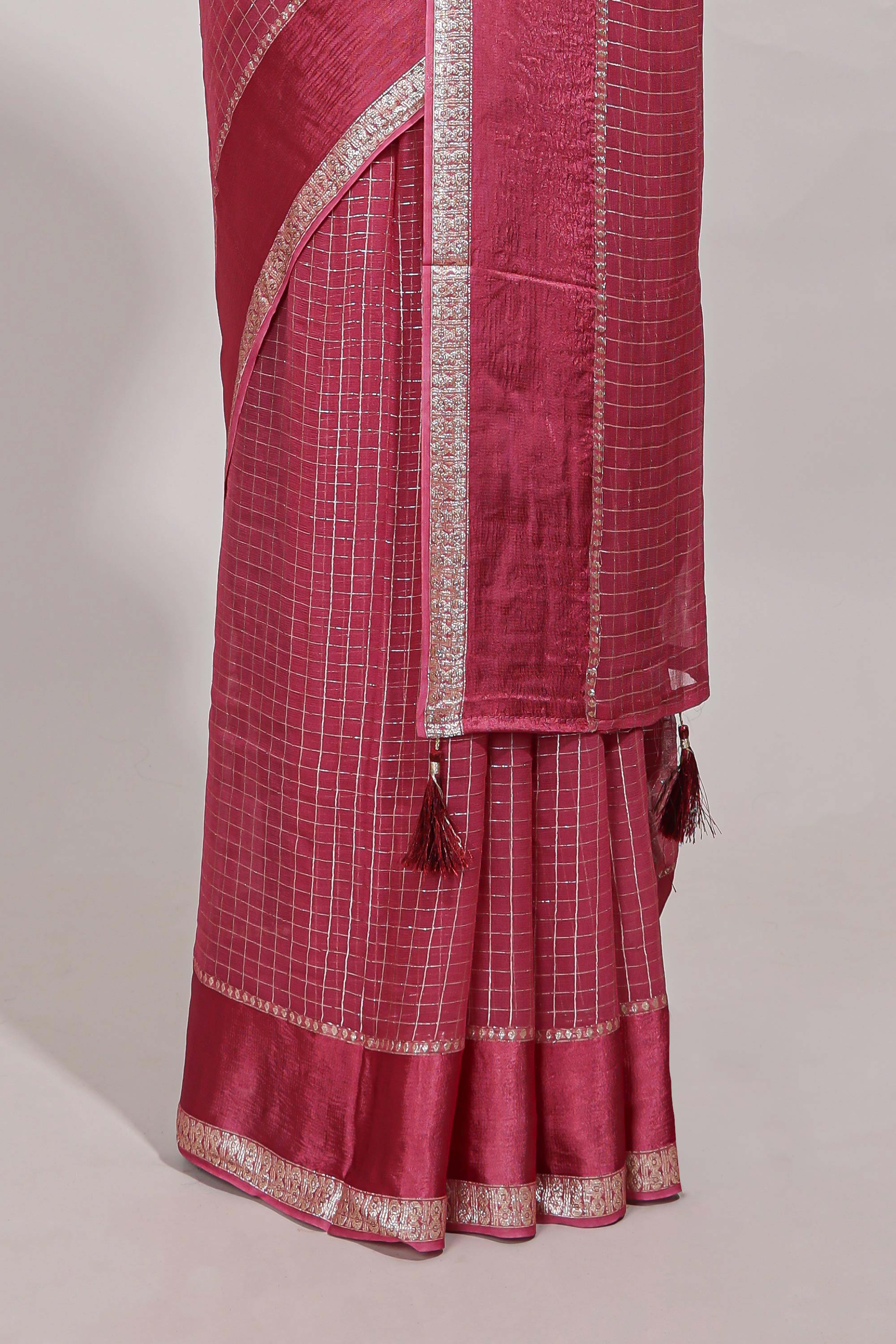 Magenta zari checks georgette saree with small zari border and contrast aari work blouse