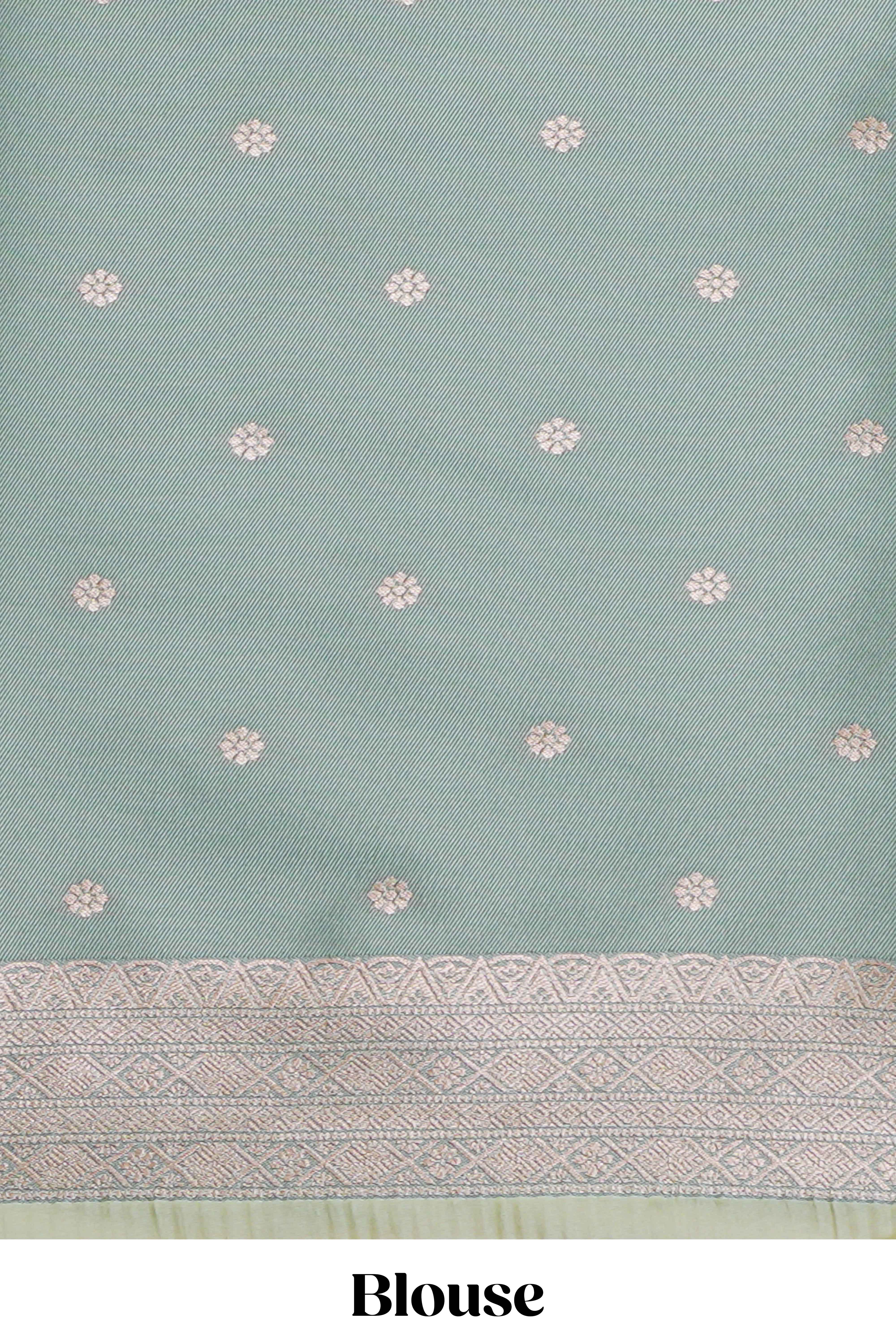 Green geometric motifs design ikkat cotton saree with contrast zari design border and zari floral motifs blouse