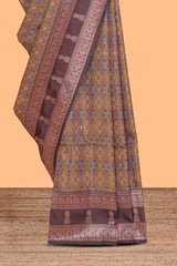 Mustard floral design ikkat cotton saree with contrast zari design border and zari floral motifs blouse