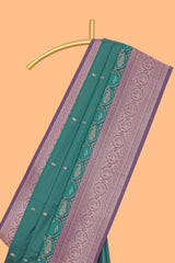 Green floral design zari motifs ikkat cotton saree with contrast zari design border and zari floral motifs blouse