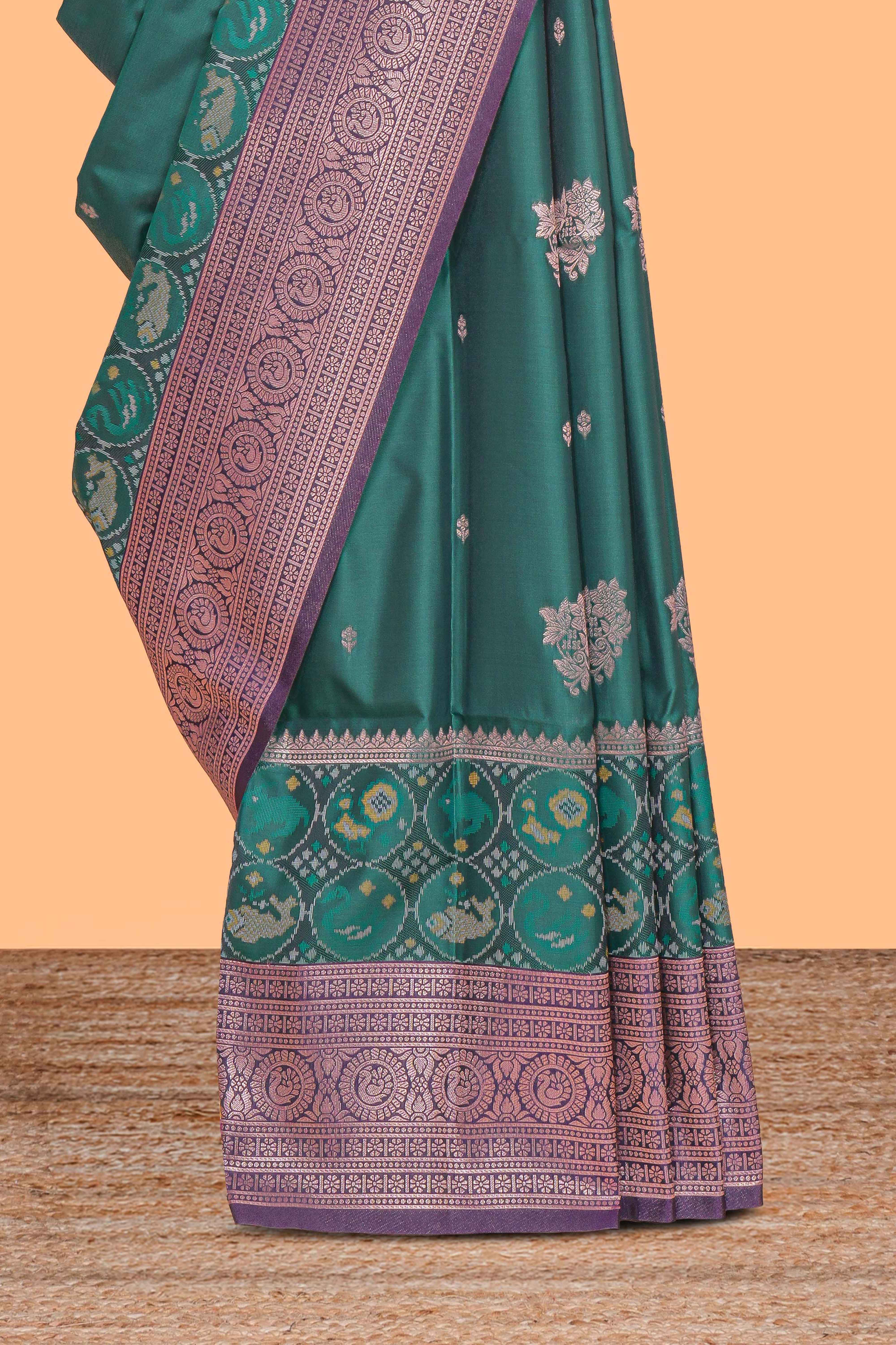 Green floral design zari motifs ikkat cotton saree with contrast zari design border and zari floral motifs blouse