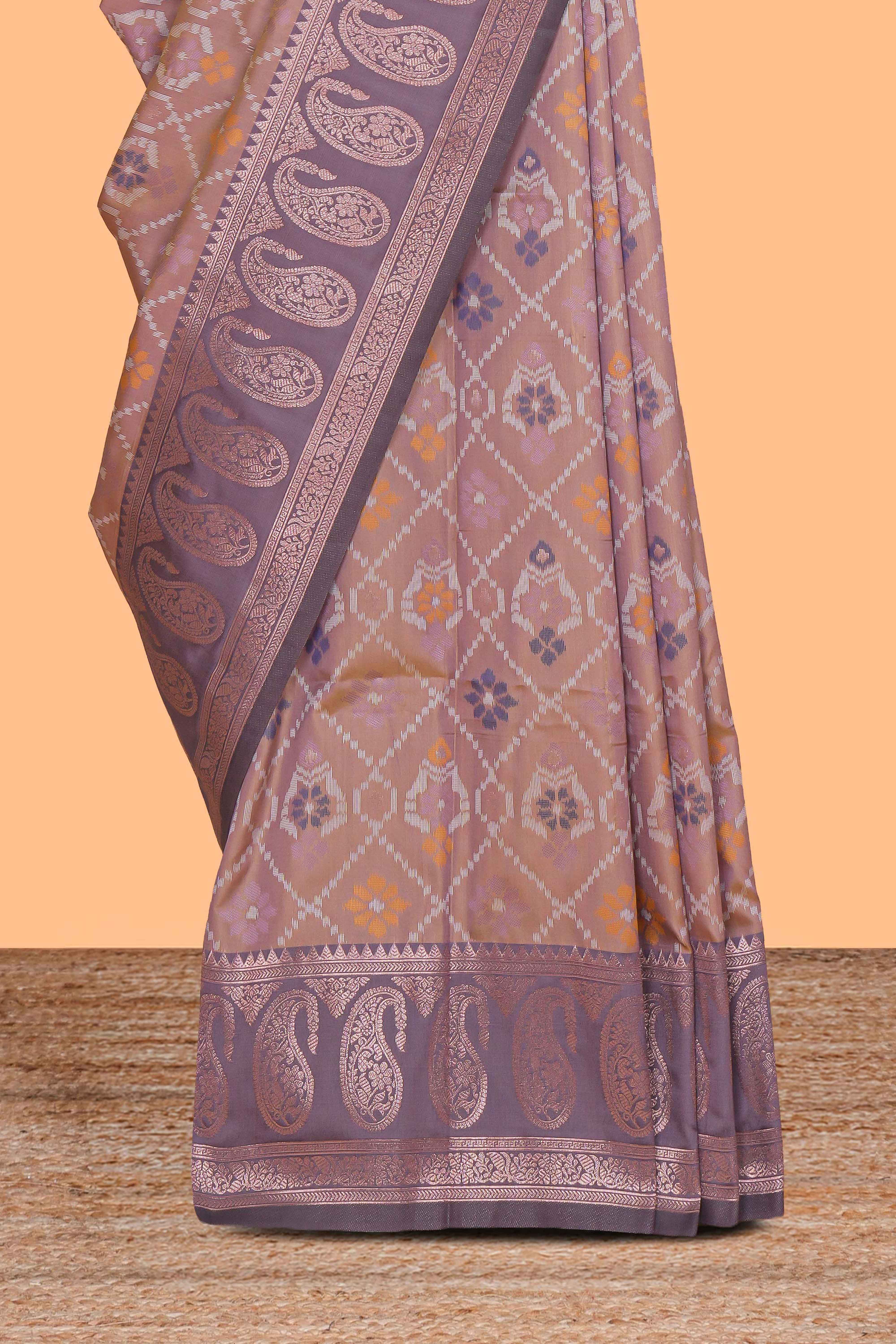 Pastel peach floral design zari motifs ikkat cotton saree with contrast zari design border and zari floral motifs blouse