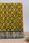 Green ikkat style motifs design ikkat cotton saree with contrast zari design border and plain blouse