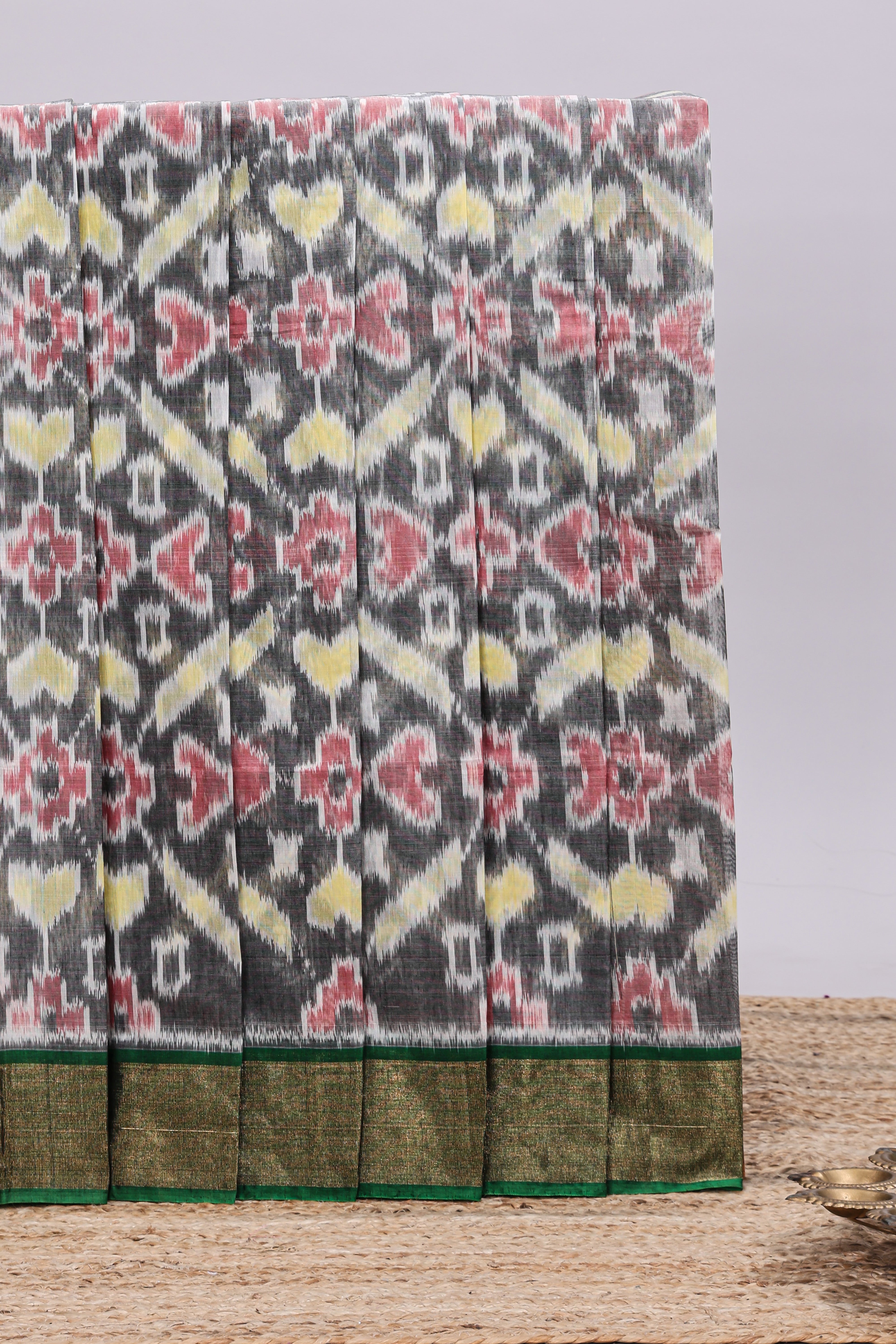 Grey ikkat style motifs design ikkat cotton saree with contrast zari design border and plain blouse