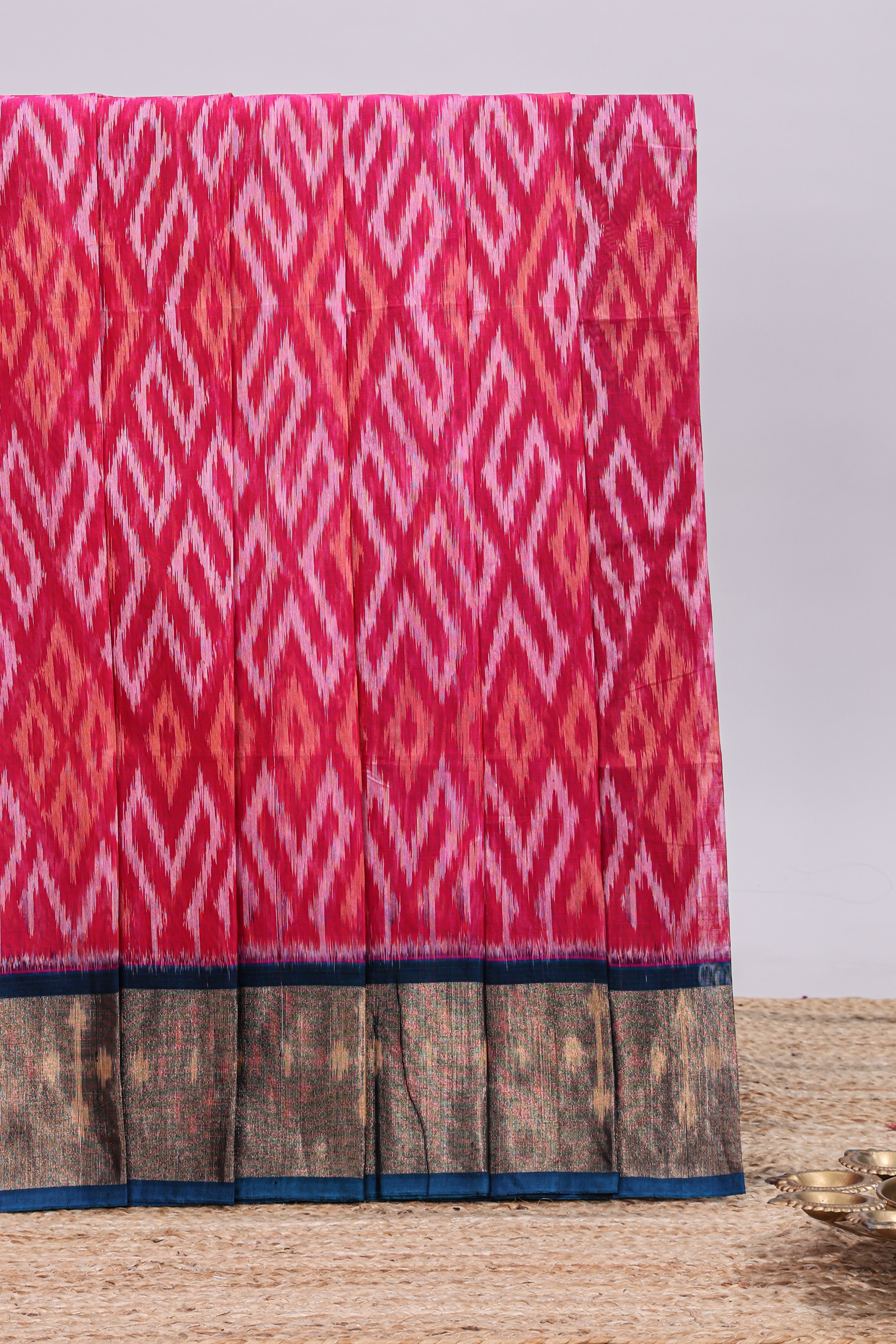 Pink ikkat style motifs design ikkat cotton saree with contrast zari design border and plain blouse
