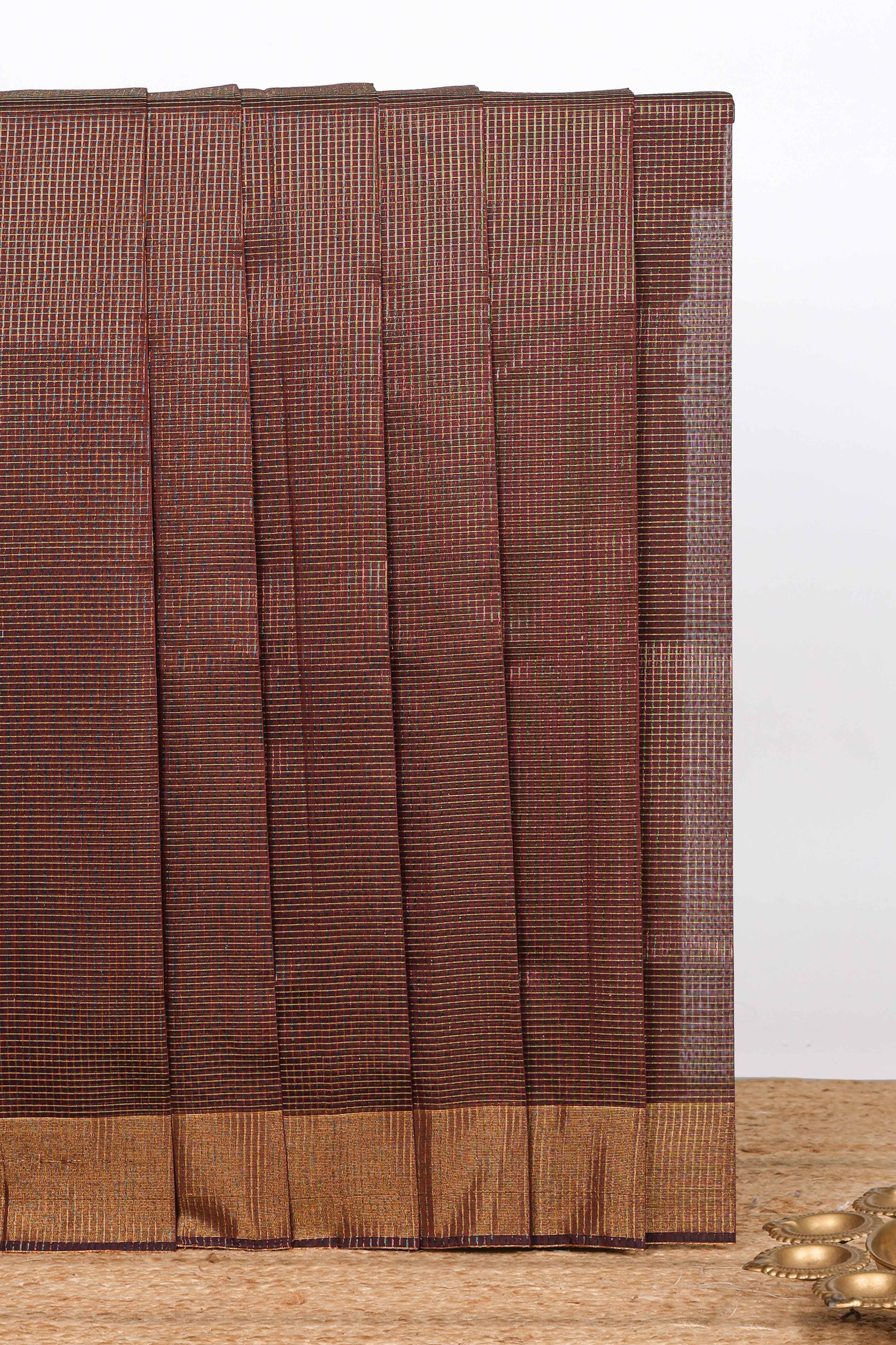 Brown shade checked ikkat cotton saree with self zari border and matching blouse
