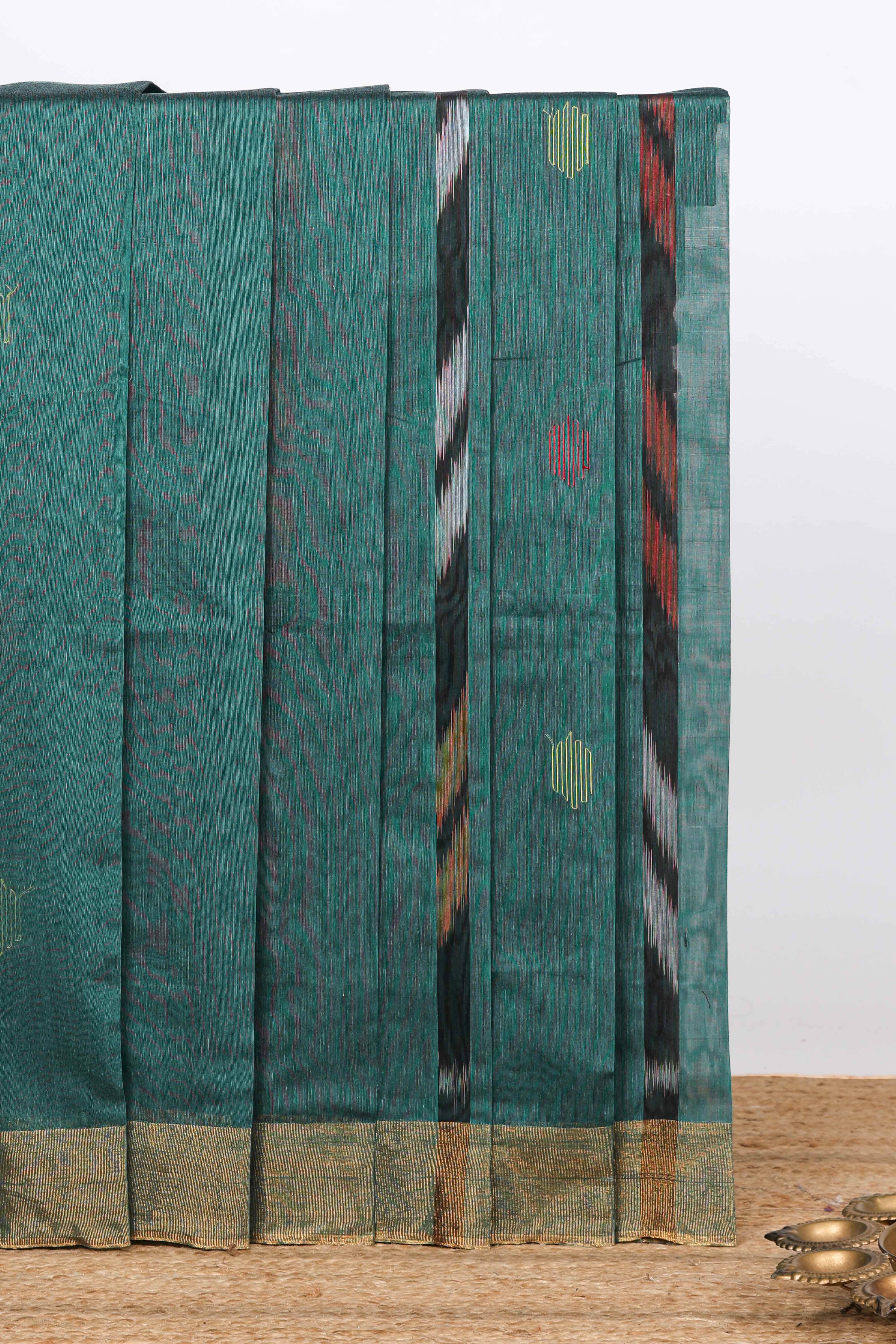 Teal green ikkat style geometric design pure ikkat cotton saree with self zari border and matching blouse comes with beautifull ikkat design pallu