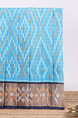 Blue ikkat design cotton saree with contrast zari border and plain blouse