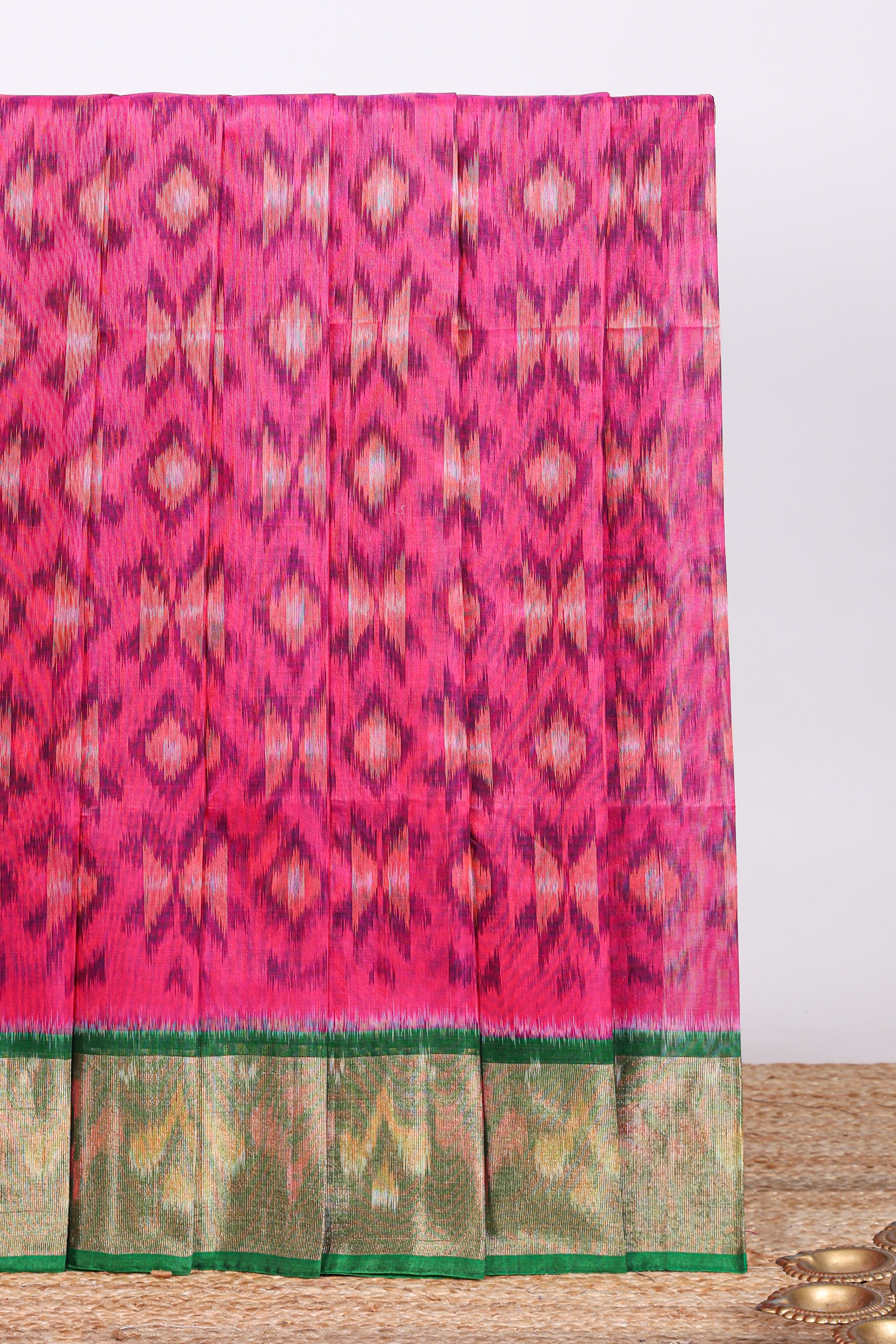 Pink ikkat design cotton saree with contrast zari border and plain blouse