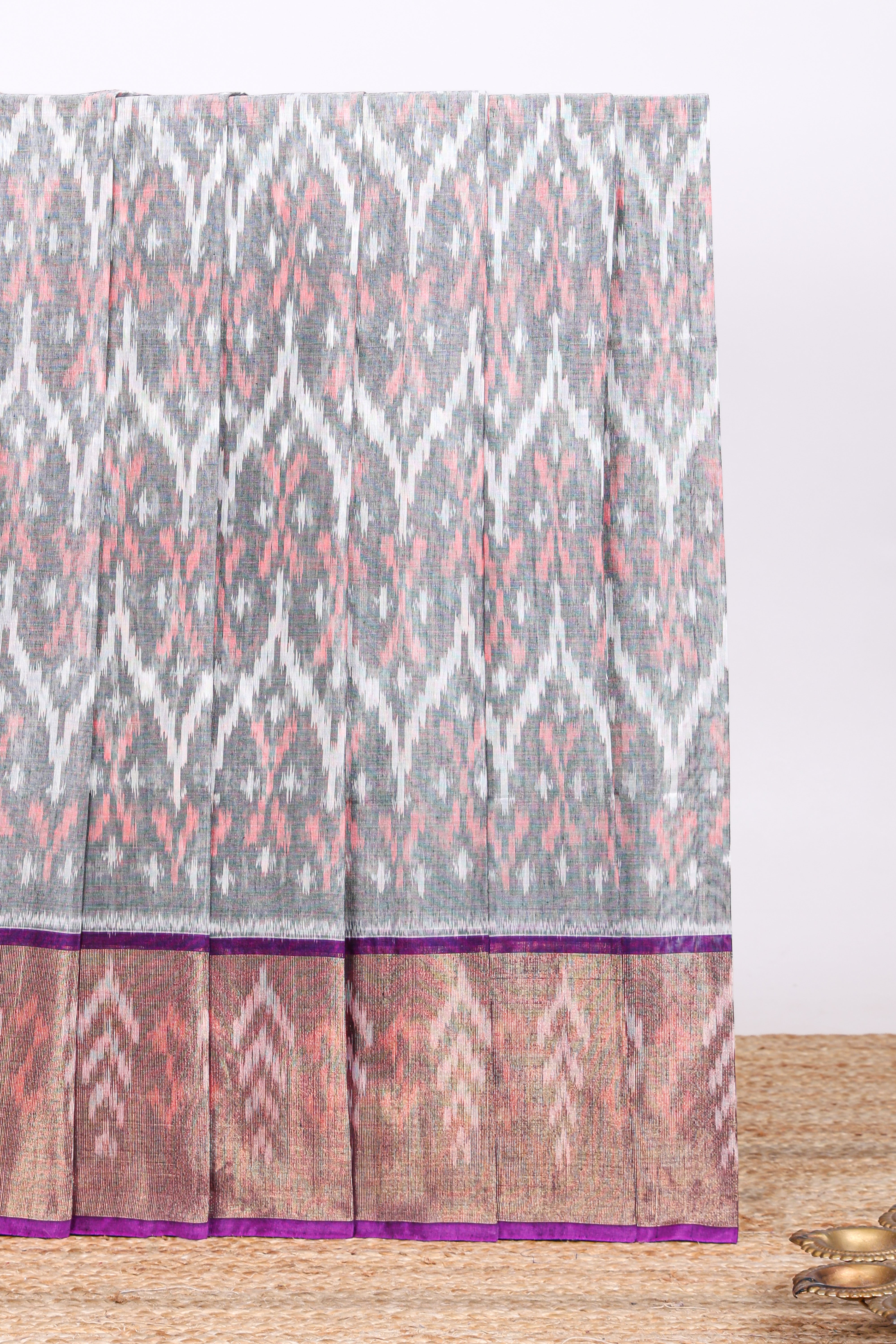 Grey ikkat design cotton saree with contrast zari border and violet Pallu and blouse