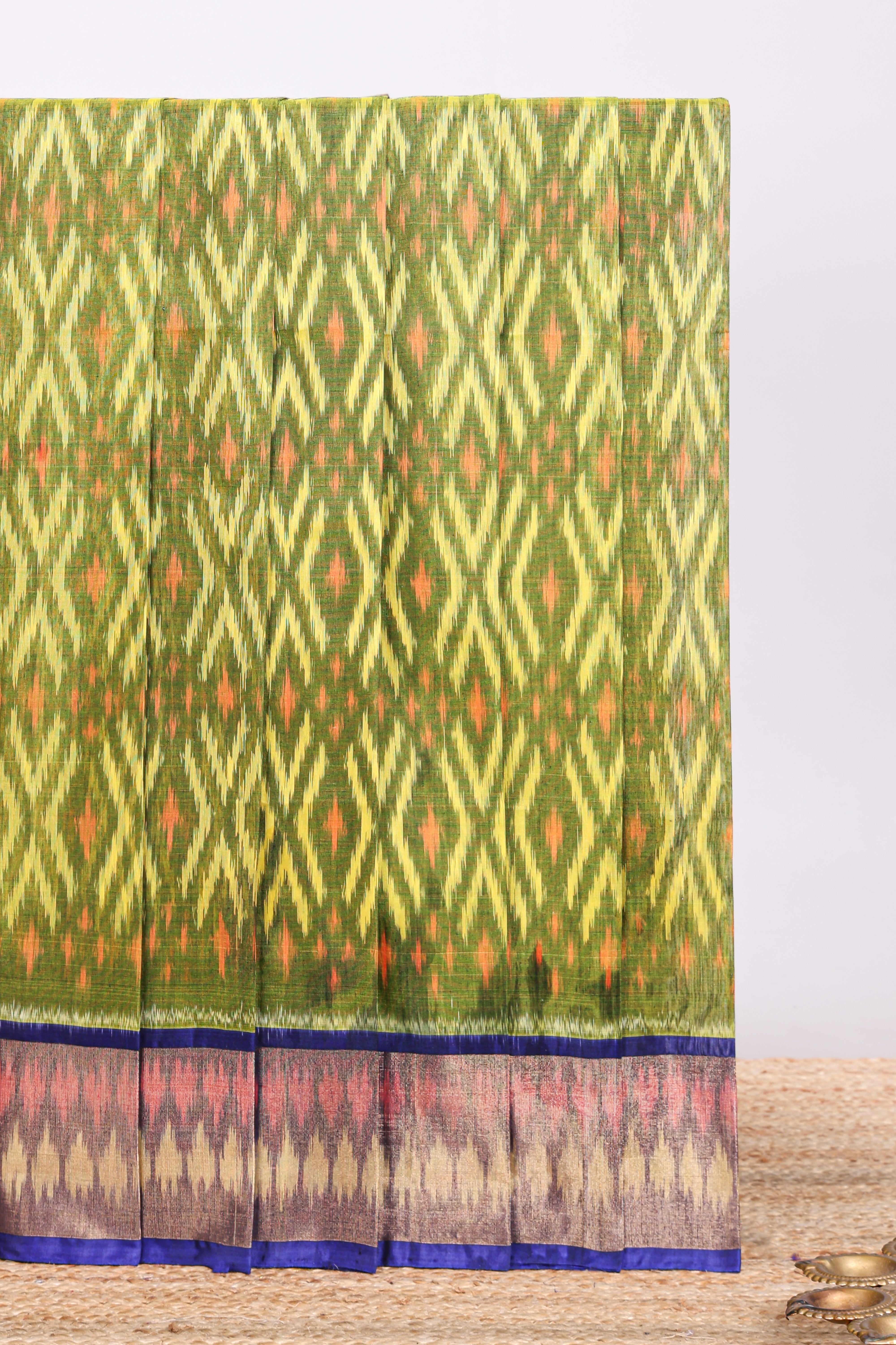 Green Geometric design ikkat cotton saree with contrast zari border and blouse