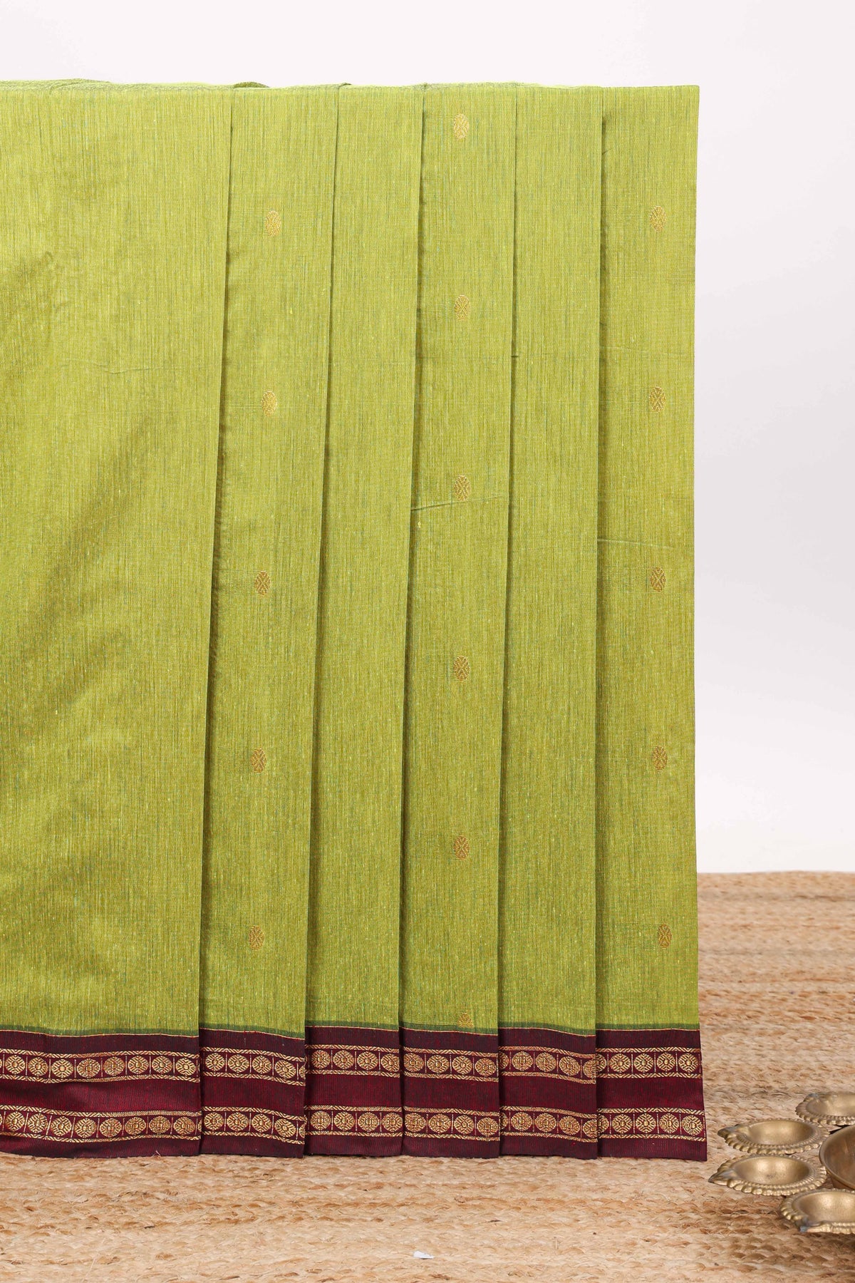 Green butta designed kalyani cotton saree with contrast border and zari designed pallu with plain blouse
