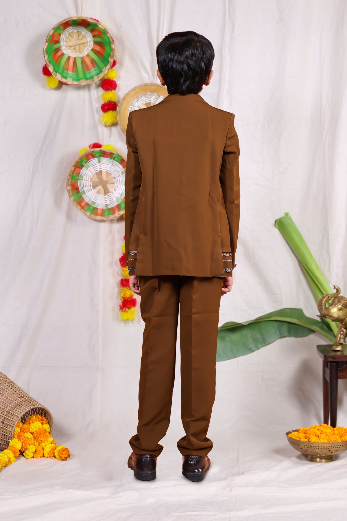 Brown boys suit set with gold piping and flower design