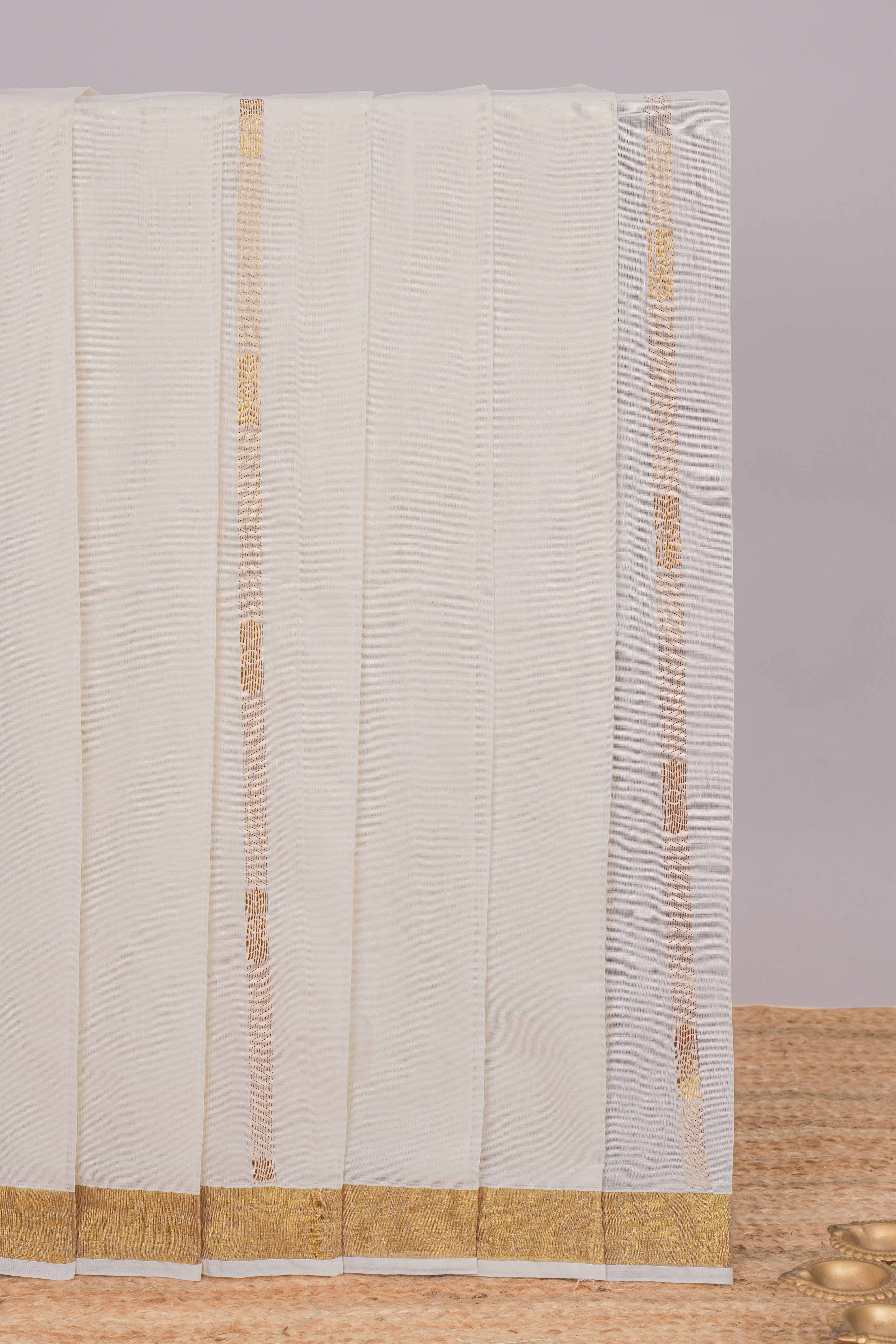 Cream zari striped design kerala cotton saree with self zari border and matching blouse