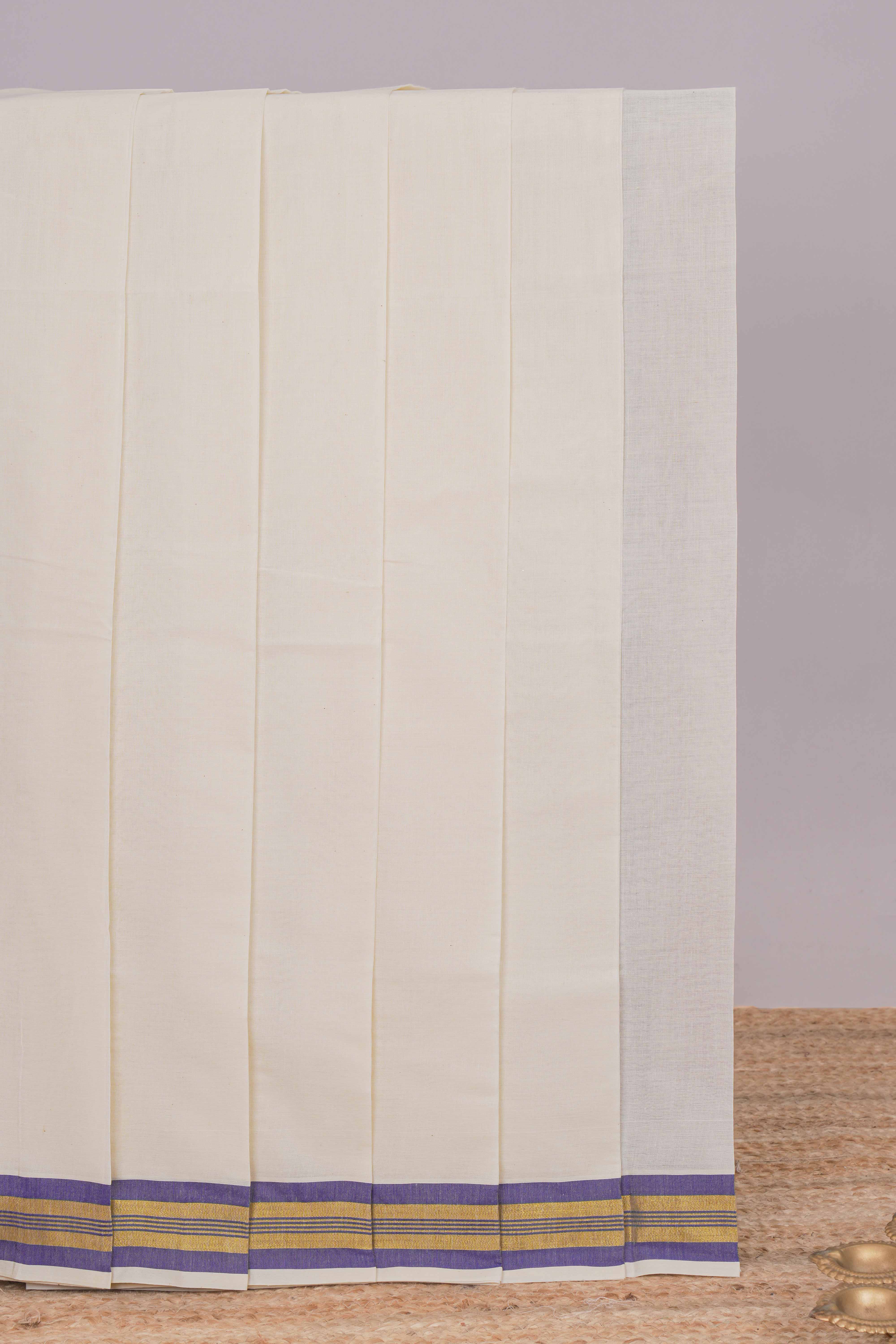 Cream plain design kerala cotton saree with self zari border and striped pallu