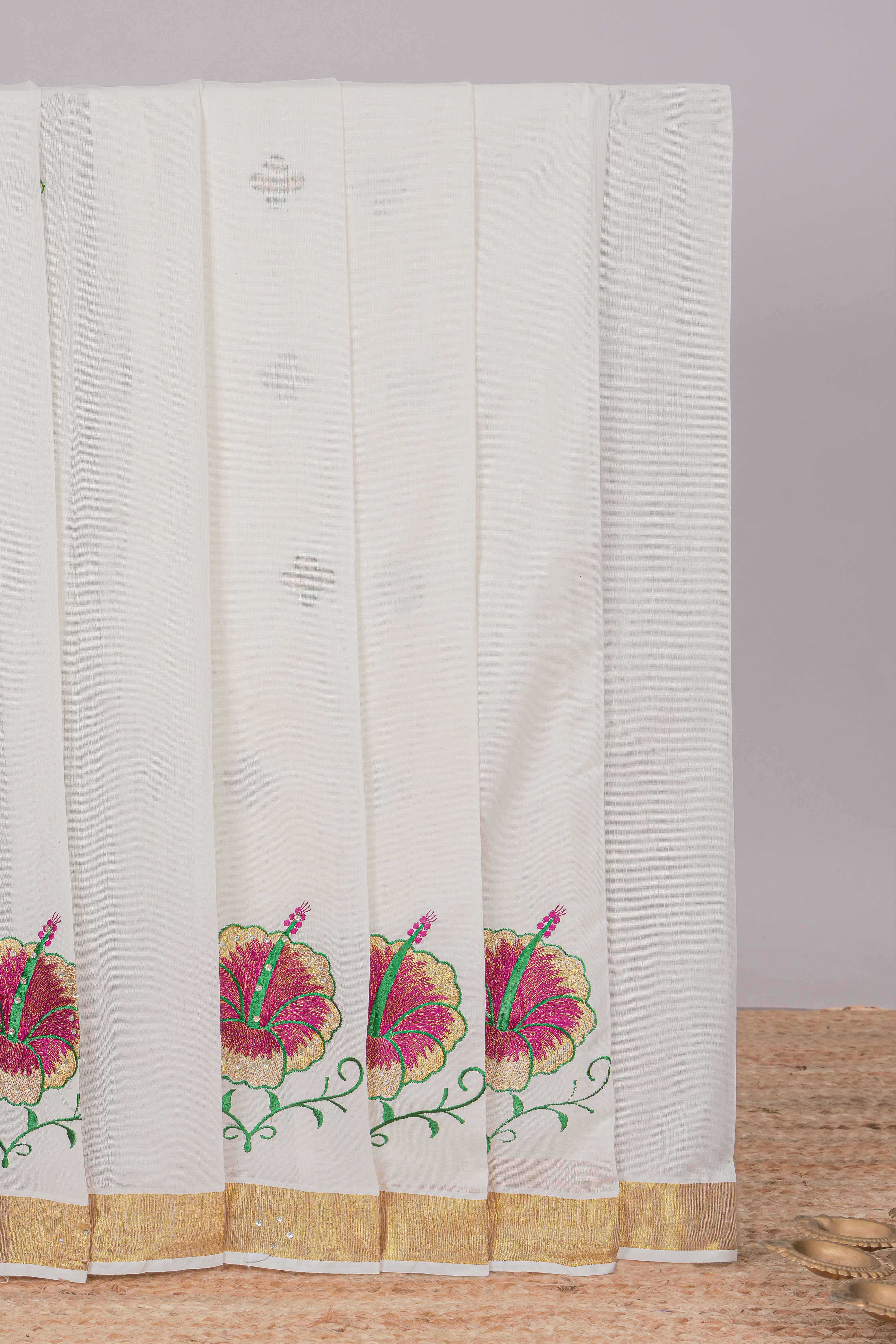 Cream floral design kerala cotton saree with self zari border and matching blouse