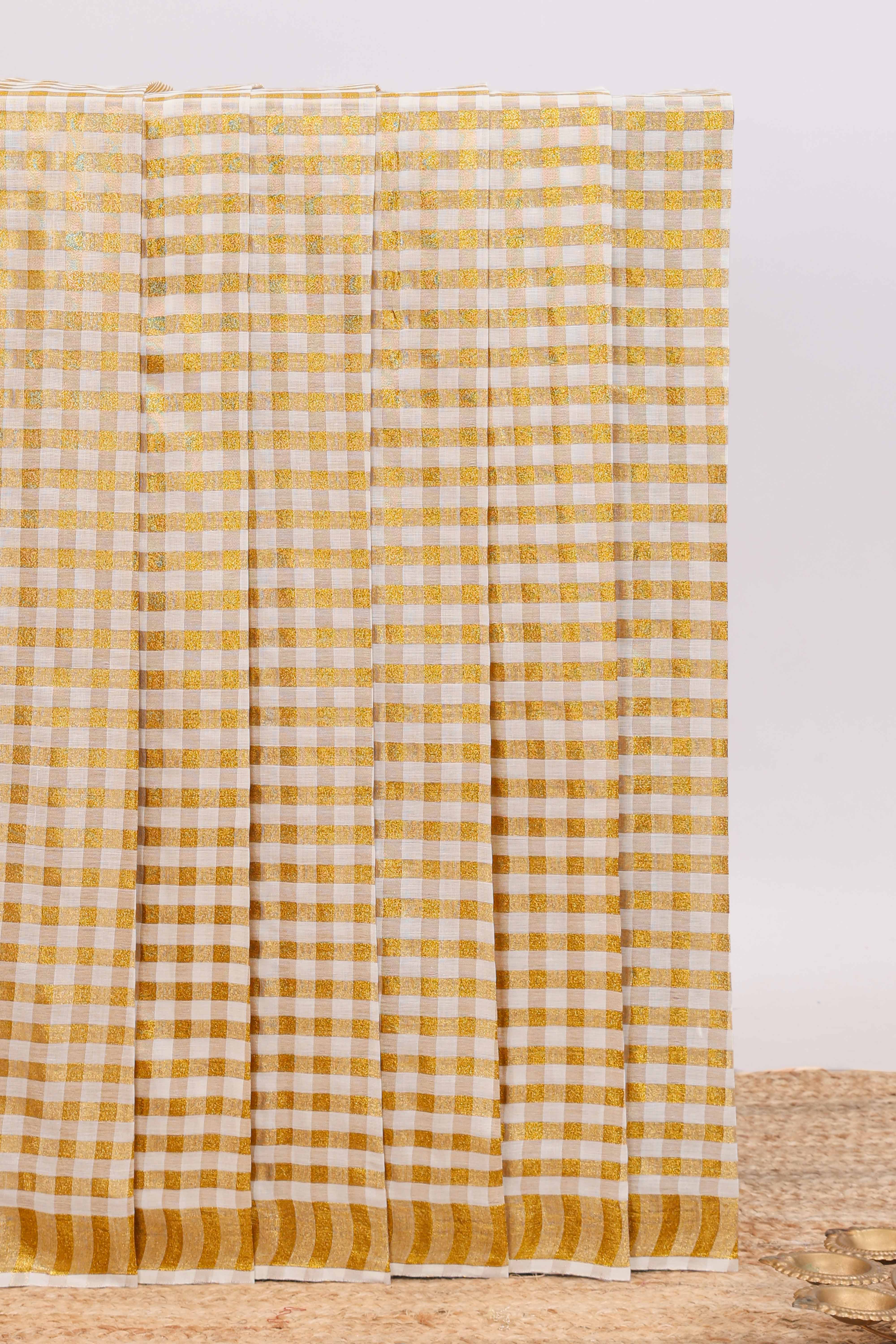 Cream golden zari checked design kerala cotton saree with self zari border and matching blouse