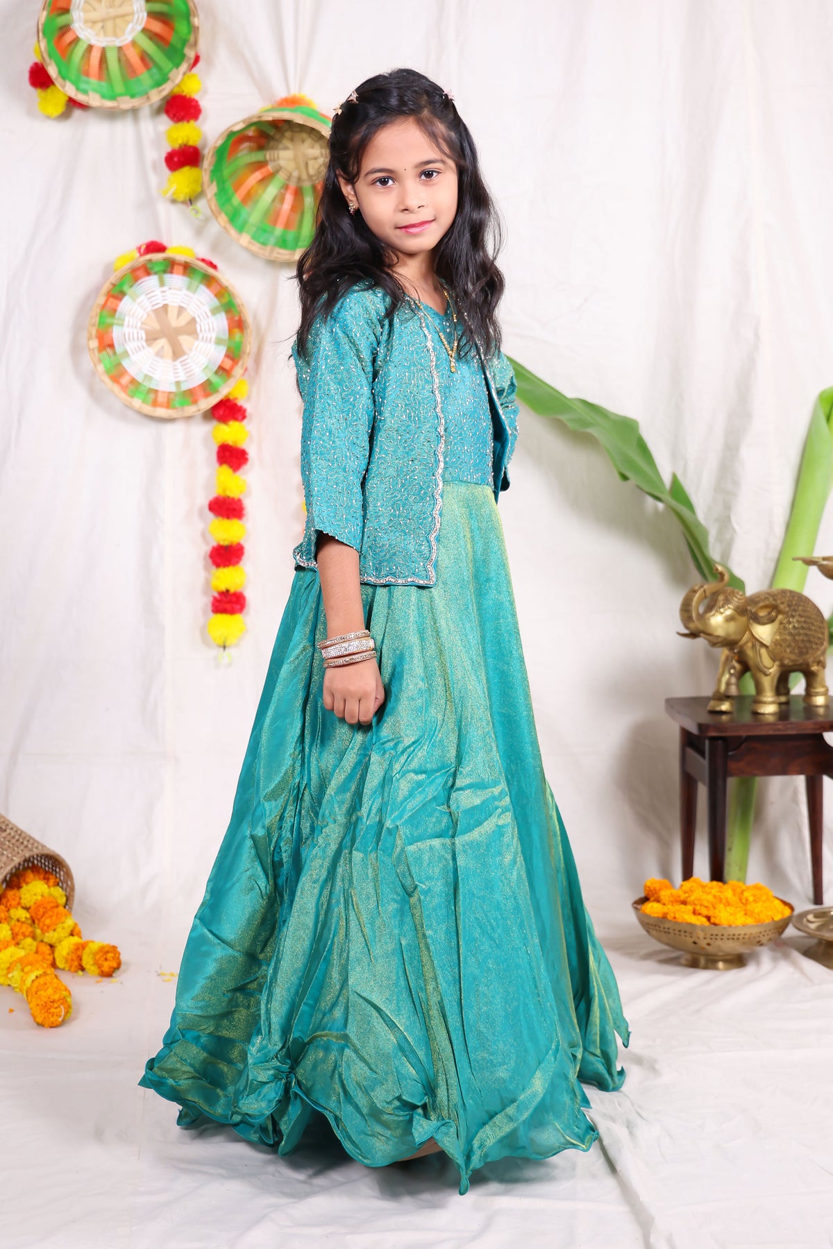 Girls Teal Green Foil Print Indo Western Lehenga Gown with Matching Embroidered Shrug Jacket