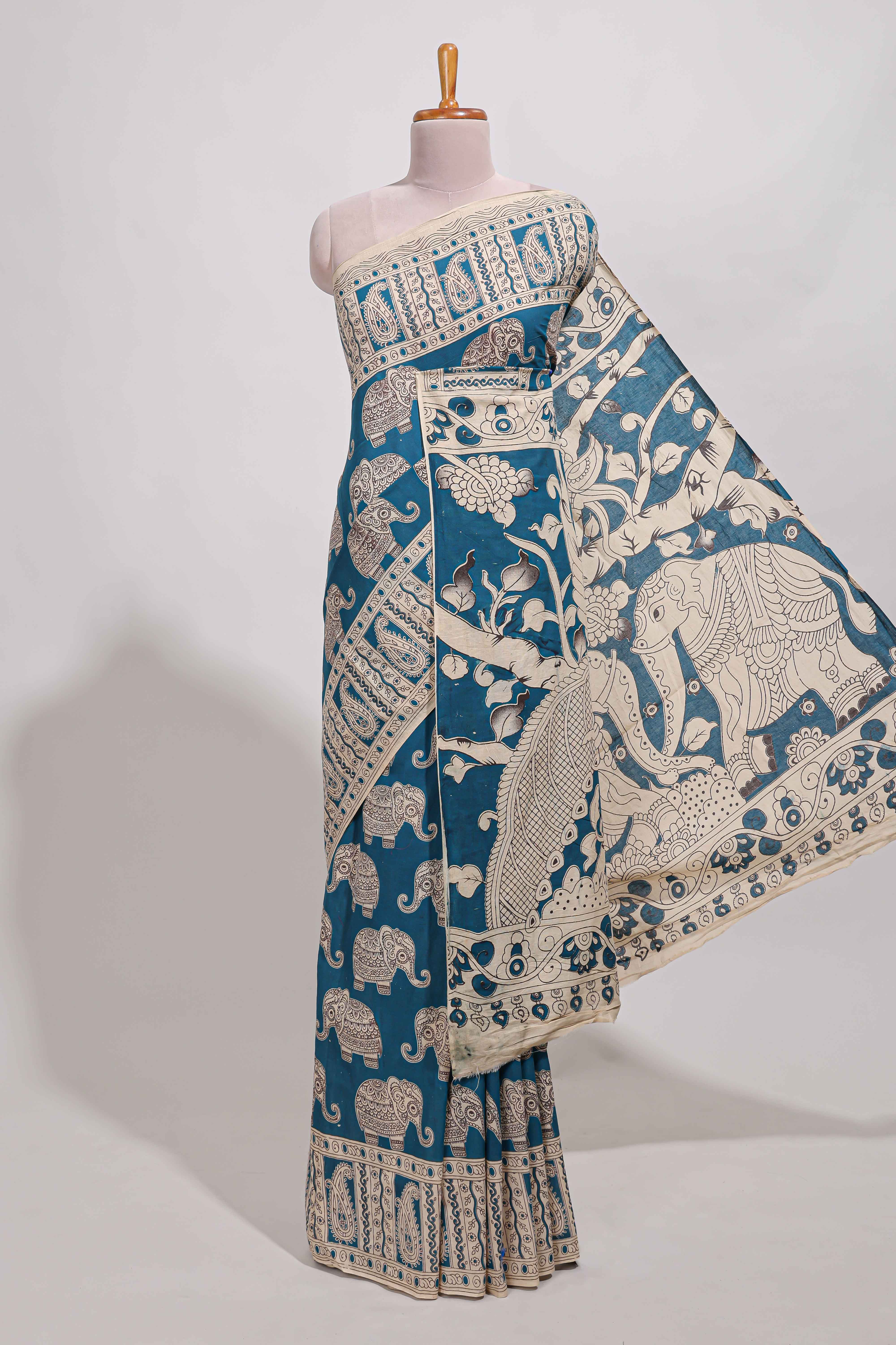 Blue kalamkari printed cotton saree with traditional floral motifs and contrast pallu