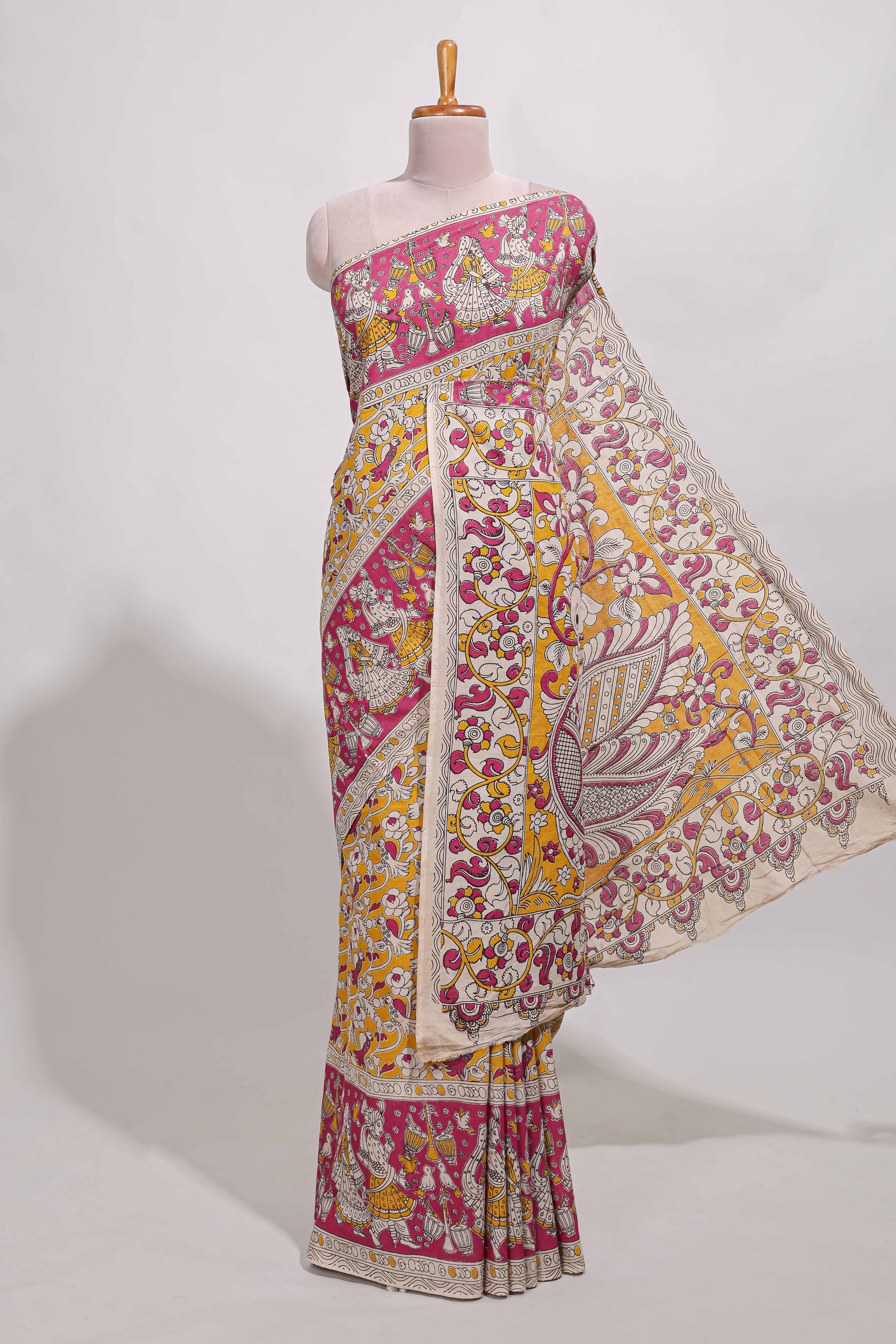 yellow kalamkari printed cotton saree with traditional floral motifs and contrast pallu