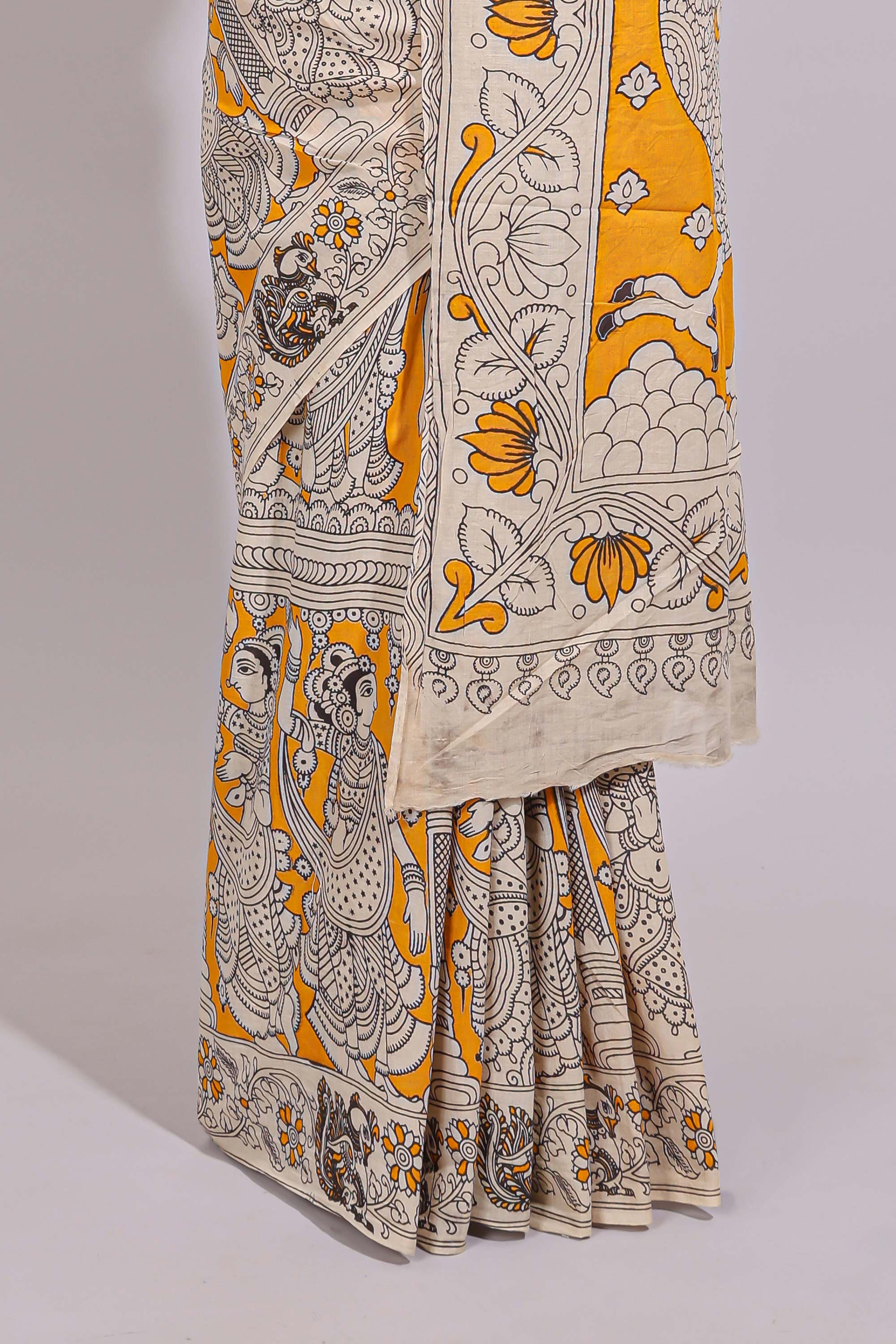 Yellow hand painted peacock & floral design kalamkari cotton saree with contrast border and floral printed blouse