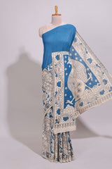 Blue hand painted peacock & floral design kalamkari cotton saree with contrast border and floral printed blouse