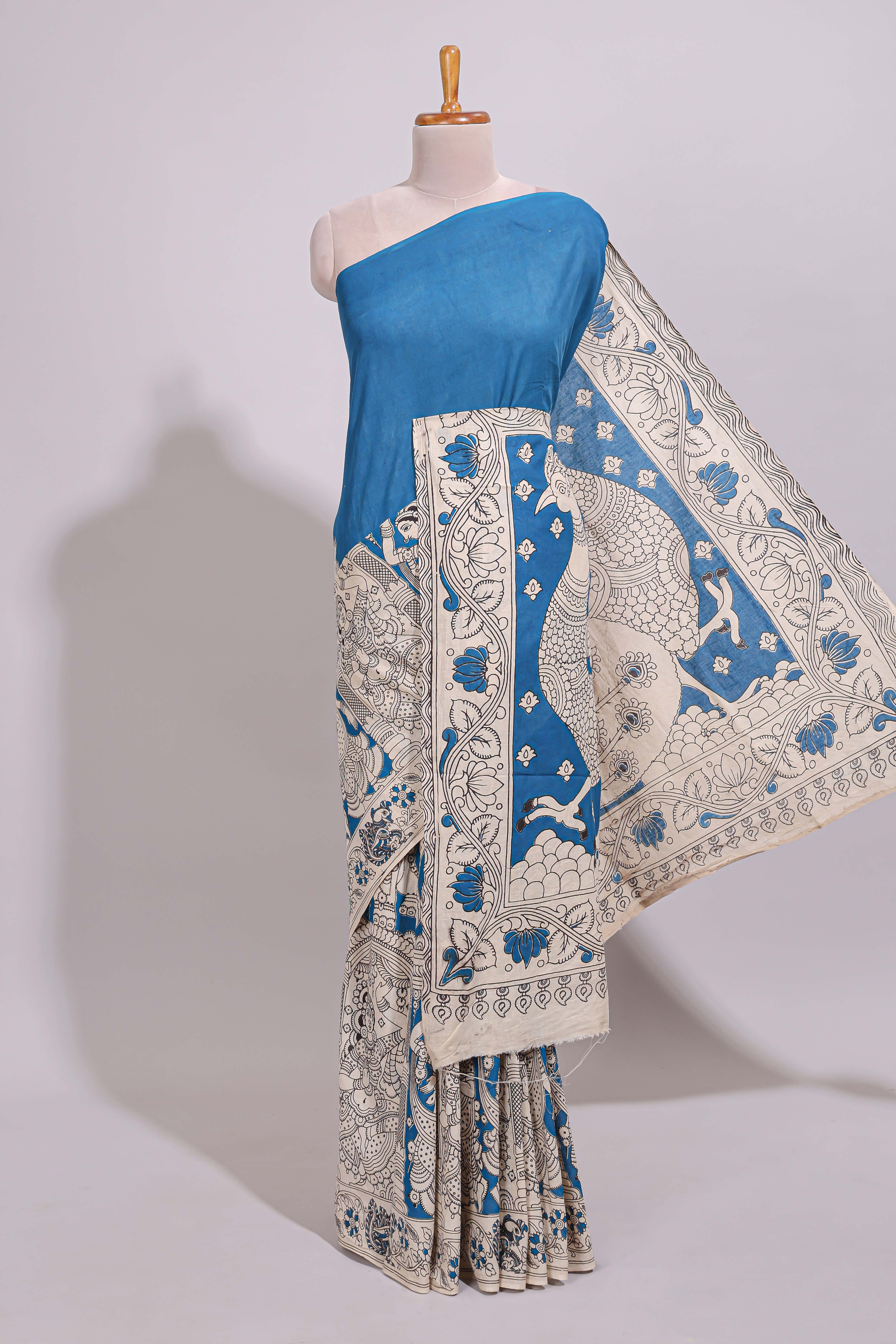 Blue hand painted peacock & floral design kalamkari cotton saree with contrast border and floral printed blouse