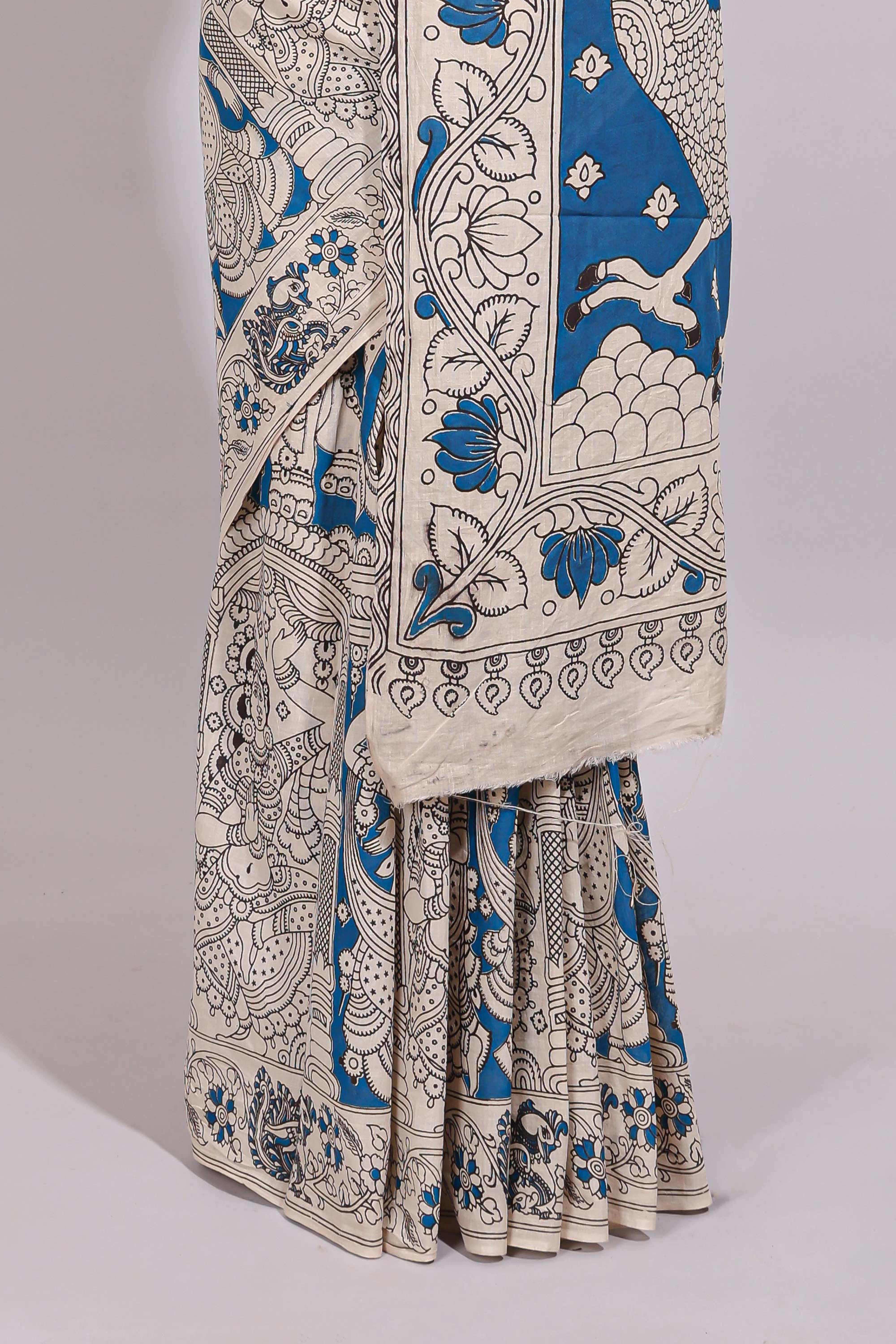 Blue hand painted peacock & floral design kalamkari cotton saree with contrast border and floral printed blouse
