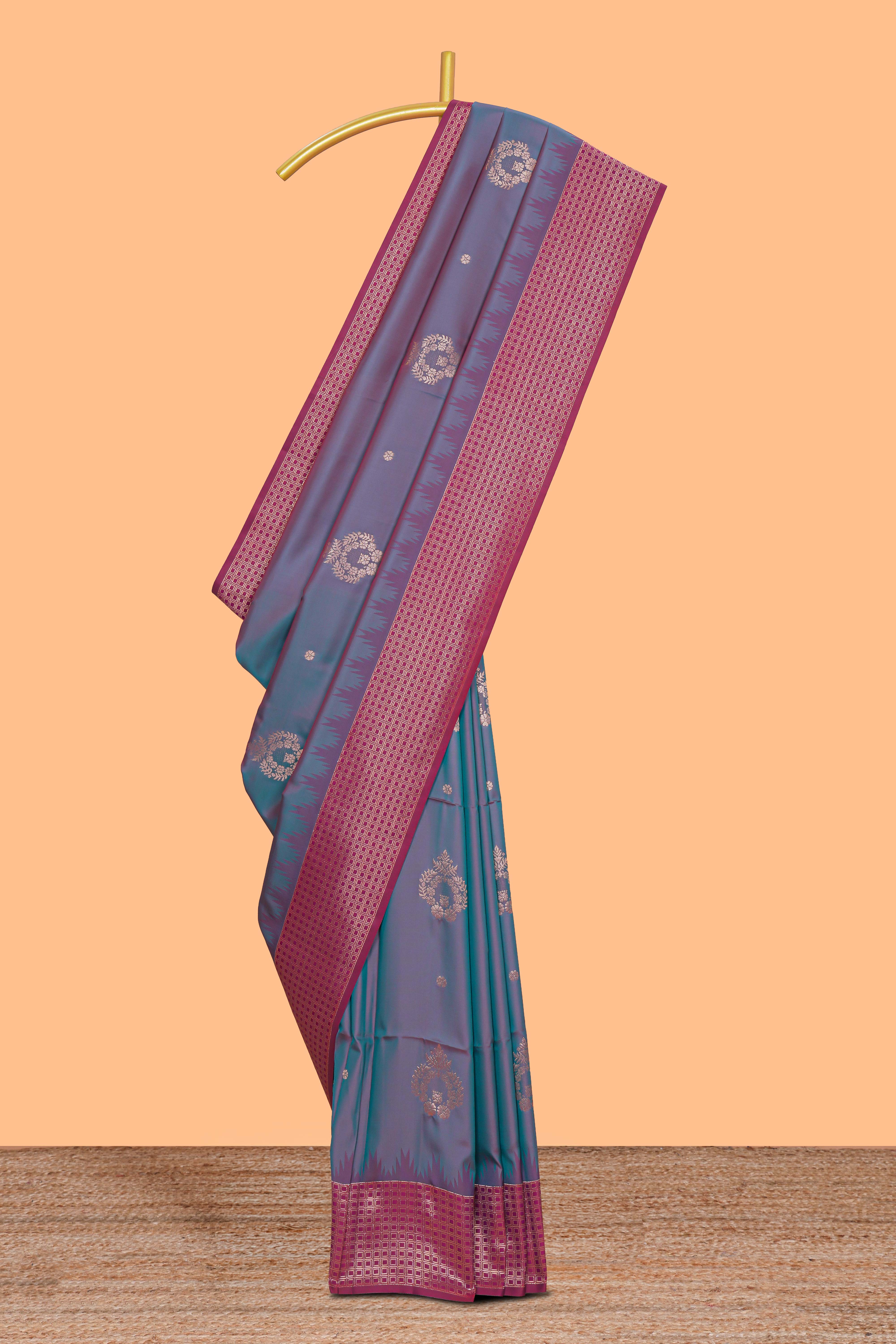 Dual tone teal blue and magenta kathan silk saree with contrast zari borders and motifs blouse