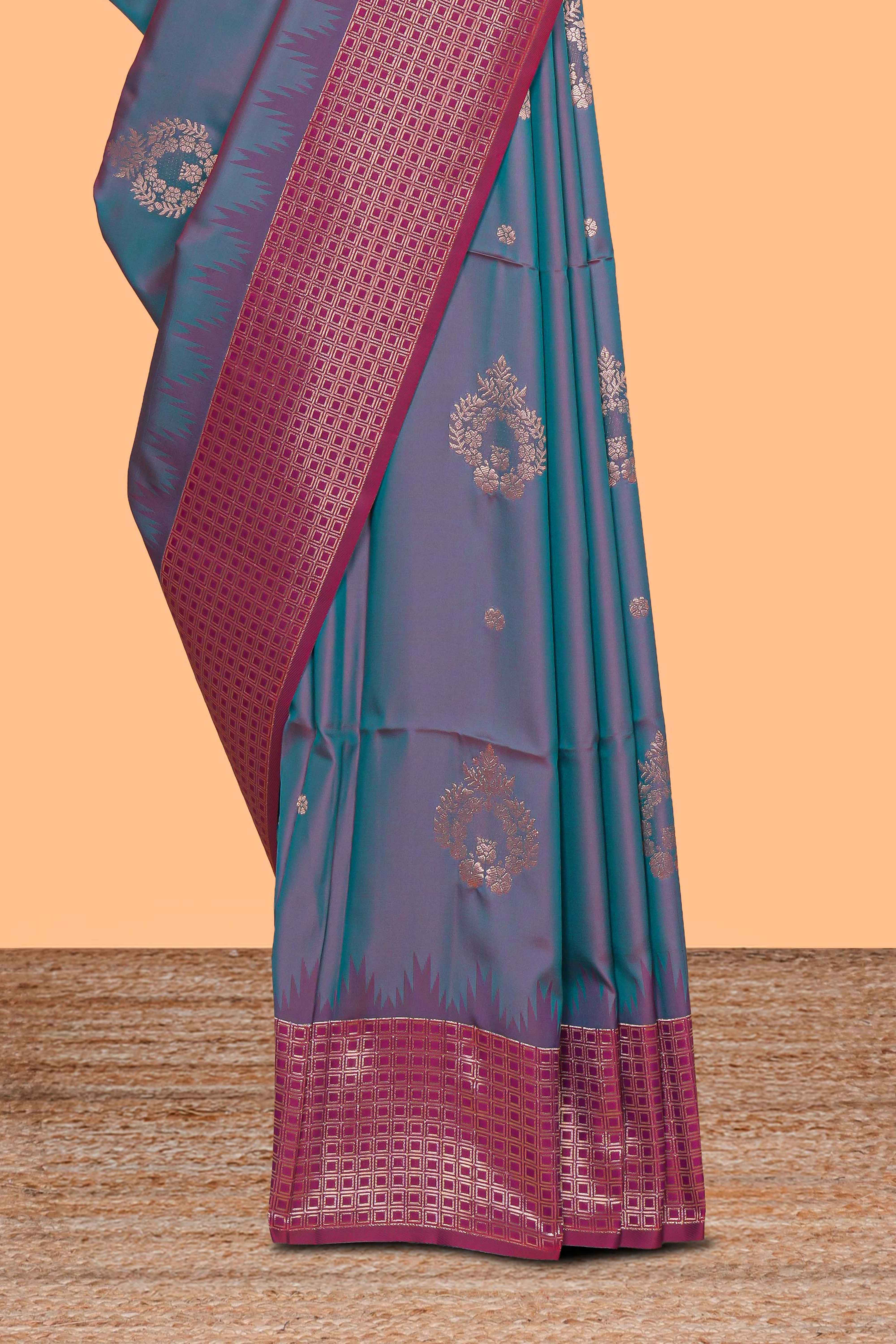 Dual tone teal blue and magenta kathan silk saree with contrast zari borders and motifs blouse