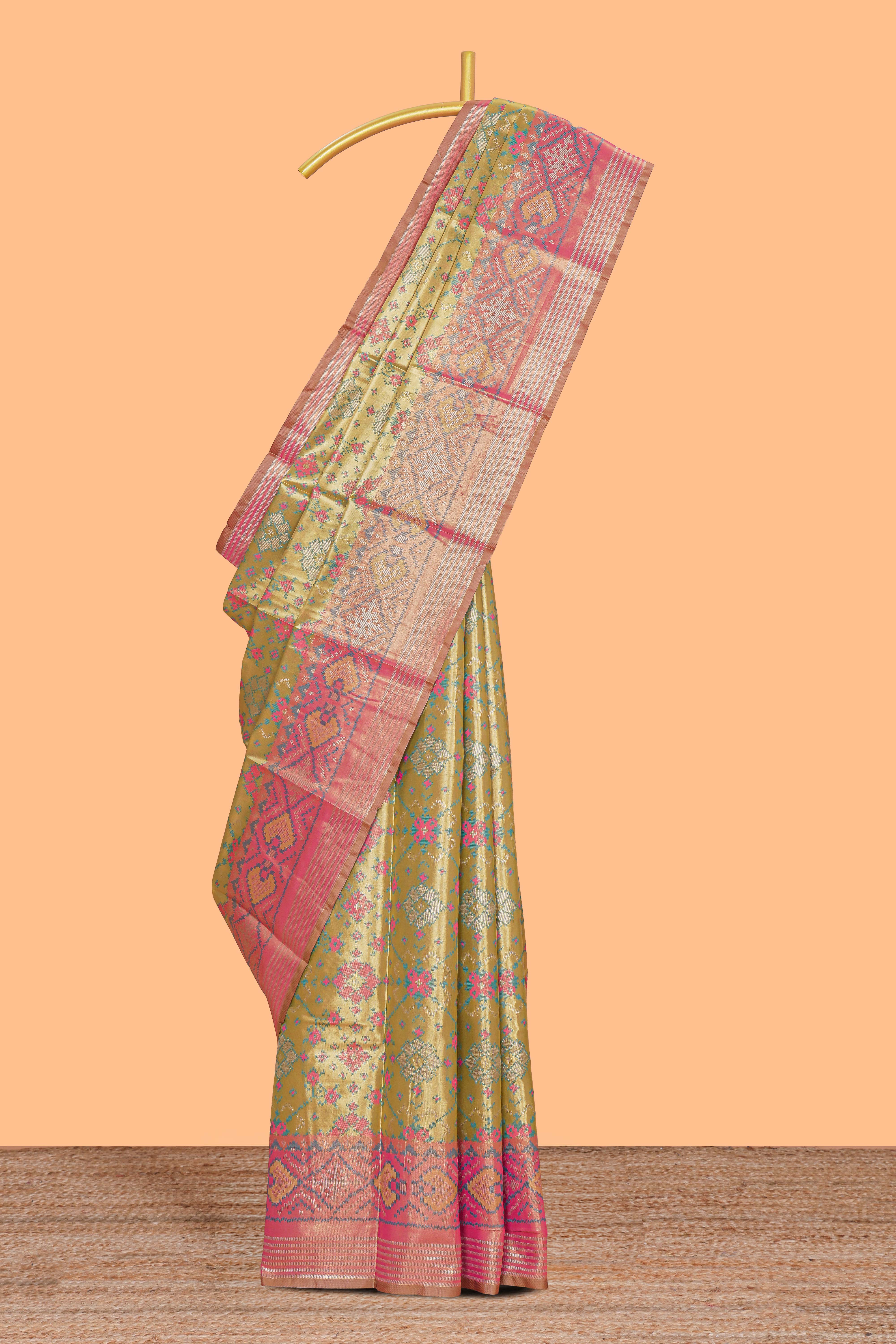 Green ikkat floral design kathan silk saree with contrast borders and motifs blouse