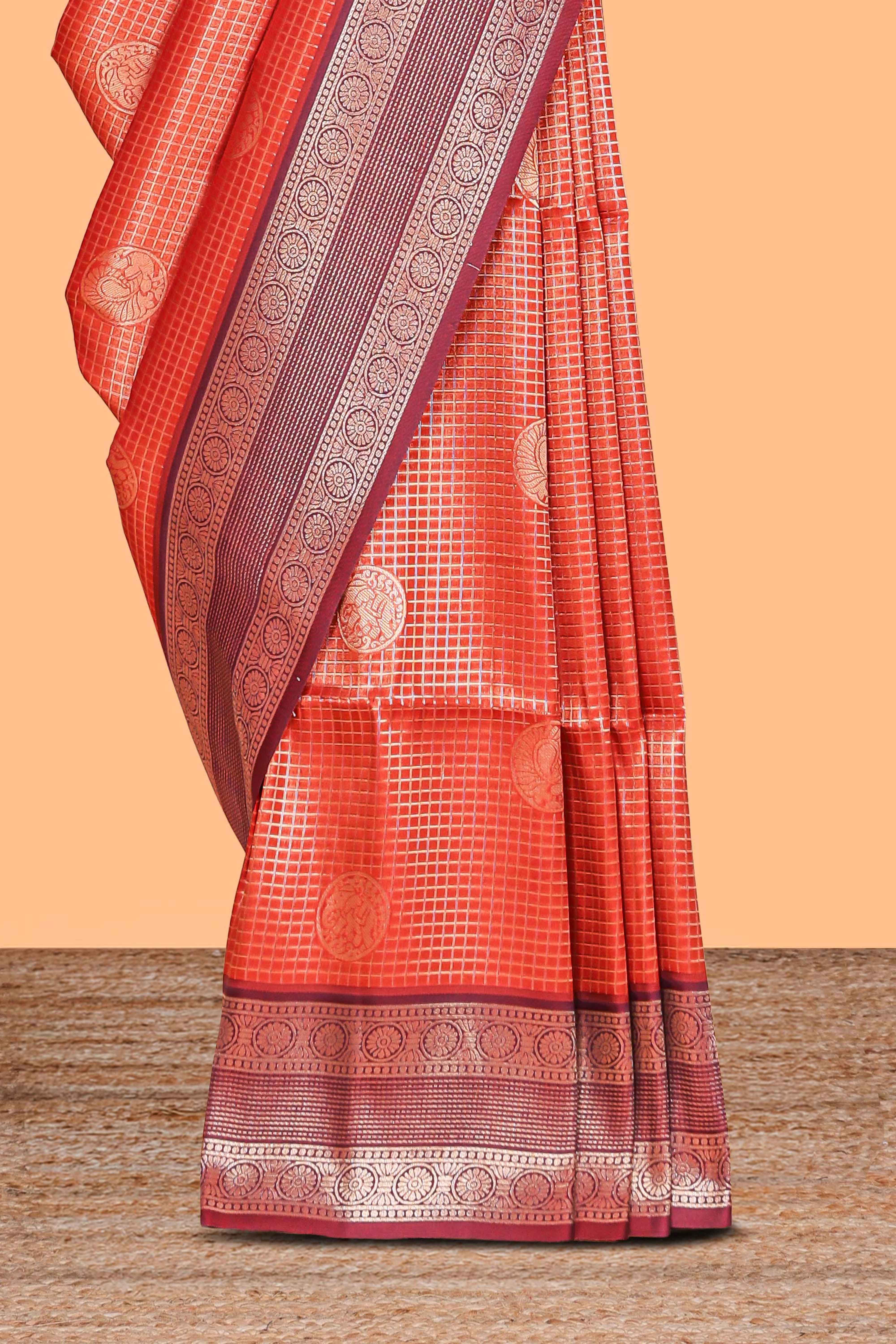 Orange checked motifs zari design kathan silk saree with contrast border and motifs blouse