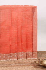 Orange checked kota cotton saree with contrast border and floral design blouse