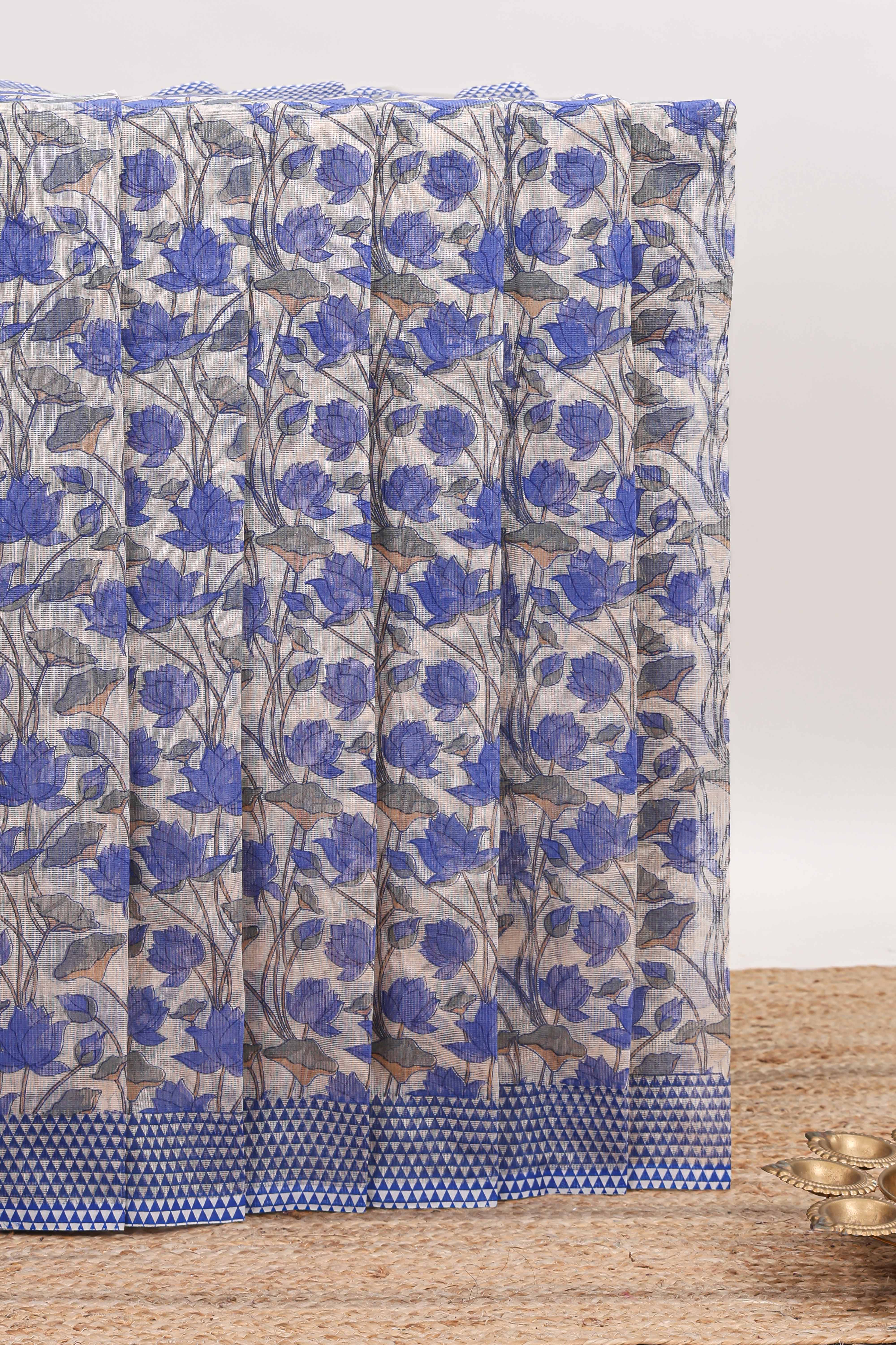 Cream floral design kota cotton saree with contrast border and geometric print blouse