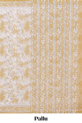 Cream floral design kota cotton saree with self border and matching floral print blouse